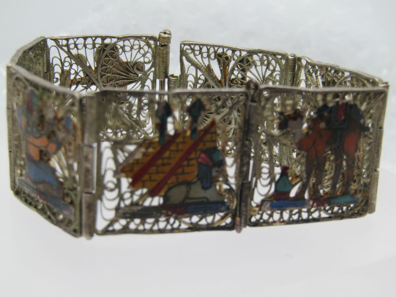 Vintage Silver Enameled Egyptian Filigree Bracelet, 7.25", Pin Clasp,: Vintage .800 to .925 Silver Enameled Egyptian Filigree Bracelet, 7.25", Pin Clasp, 1" wide , seven tiles. Souvenier bracelet. Each is connected to the next by a hinged. One of the tiles has been
