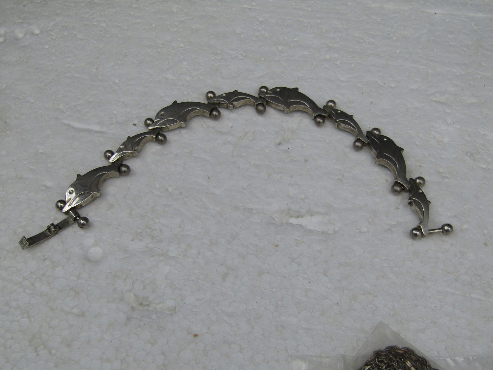 Vintage Arched Dolphin Link Bracelet, 7.25", Stainless Steel 11mm wide: Vintage Dolphin Link Bracelet, 7.25", Stainless Steel 11mm wideVintage Jumping Dolphin Link Bracelet, 7.25", Stainless Steel 11mm wideEach links is an alternating dolphin in an arched position like th