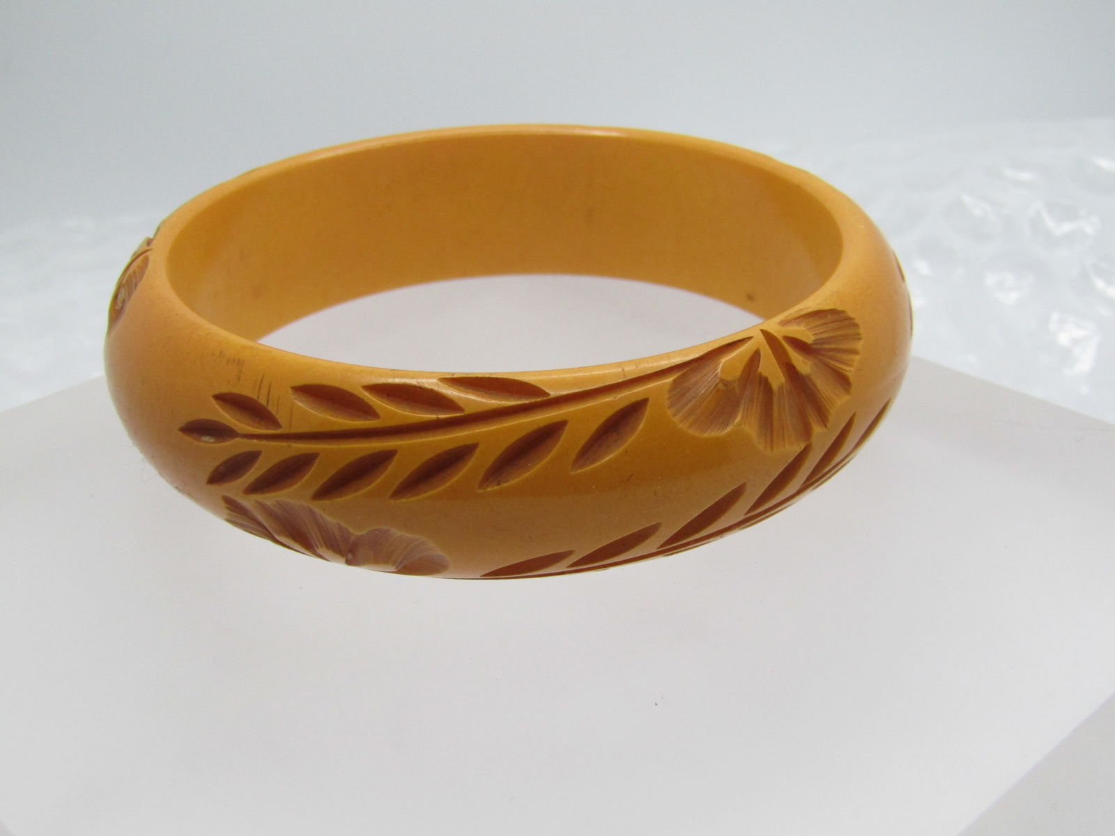 Vintage Carved Bakelite Bracelet, 7.5", 3/4" Wide, Butterscotch, 1940's: Vintage Carved Bakelite Bracelet, 7.5", 3/4" Wide, Butterscotch, 1940's or earlier. This has leaves and blossoms curved in the domed butterscotch bakelite. It has an inside measurement of 7.5" with