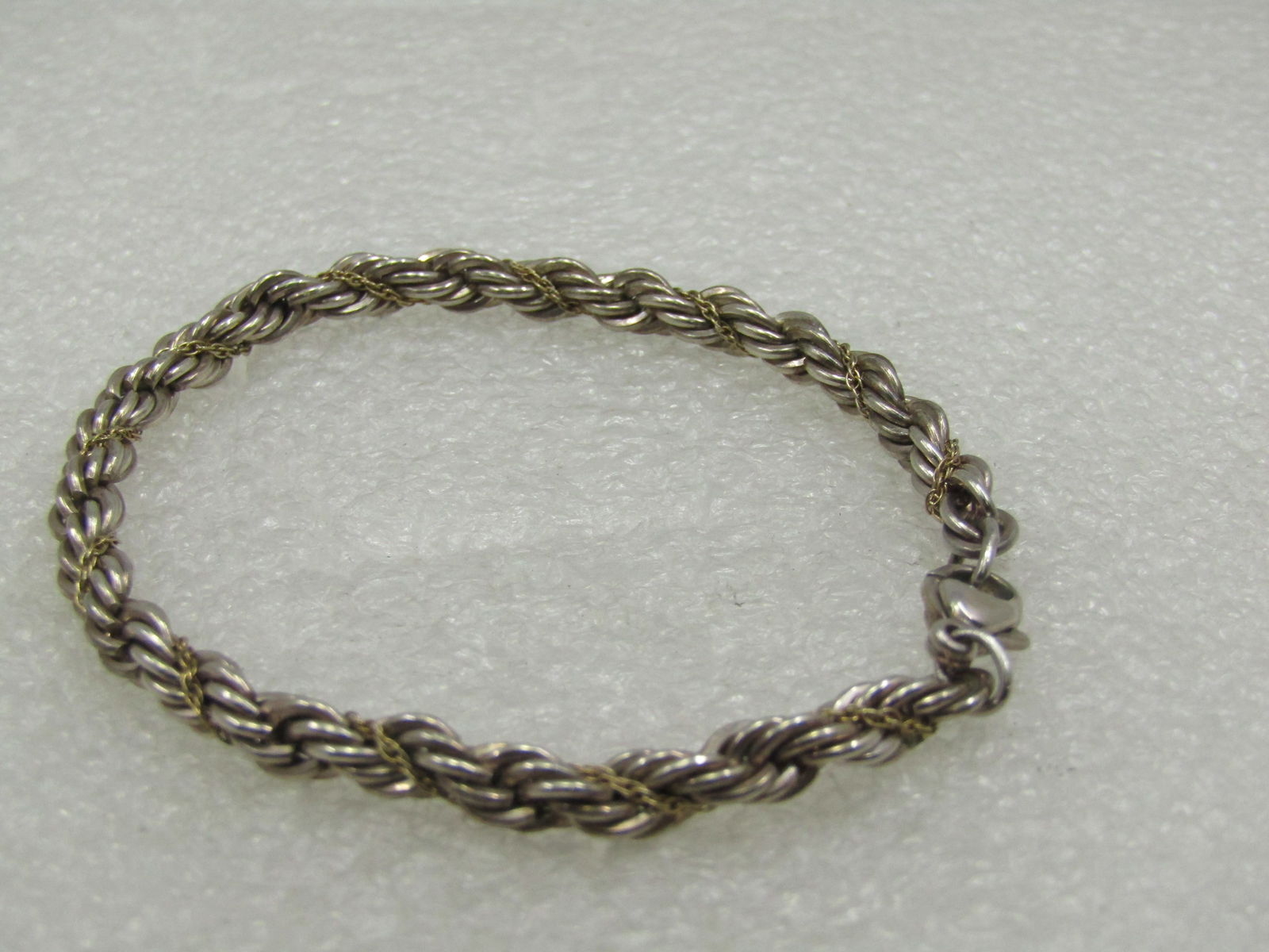 Vintage Sterling 4.5mm Twisted Rope Chain Bracelet, 7-1/8": Vintage Sterling 4.5mm Twisted Rope Chain Bracelet, 7-1/8". It is marked .925 and has a lobster clasp. Unisex. Not signed by the maker. Very good condition with light oxidation that can be polished