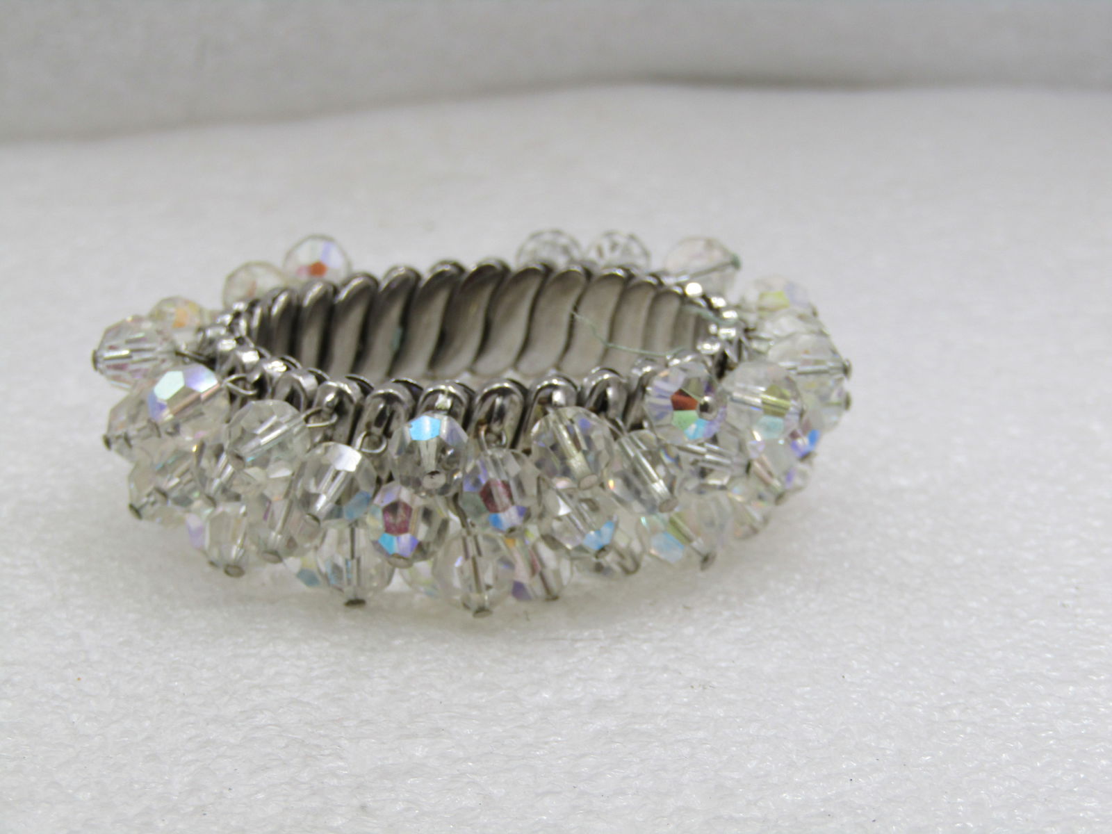 Vintage Crystal Beaded Dangle Expanding Bracelet, Mid-Century: Vintage Crystal Beaded Dangle Expanding Bracelet, Mid-Century, Expanding from 5.5" to 8". Silver tone with 7mm crystal faceted beaded dangles with an aurora borealis treatment. The bracelet is covered