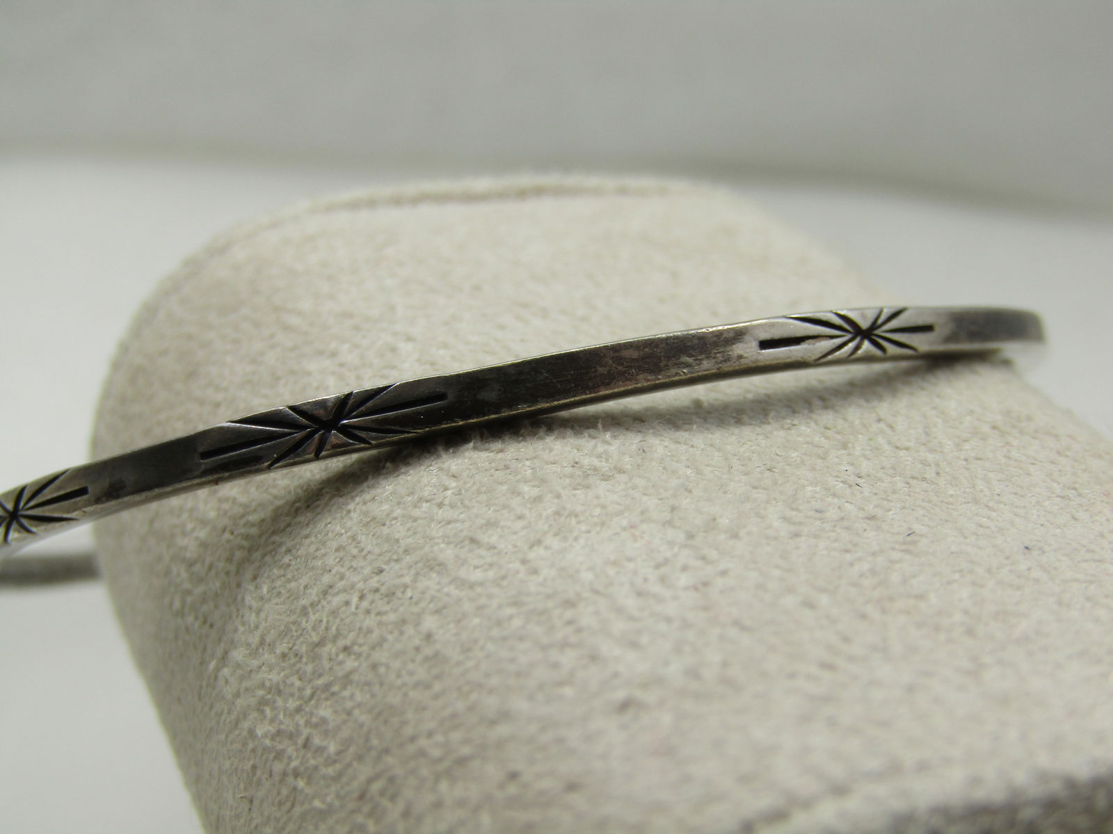 Vintage Sterling Handwrought Bangle Bracelet, 8", Engraved Bursts: Vintage Sterling Handwrought Bangle Bracelet, 8", Engraved Bursts. This is appx. 2.5mm wide and marked sterling, handwrought and has an unknown maker's mark that looks like a stylized K. It is