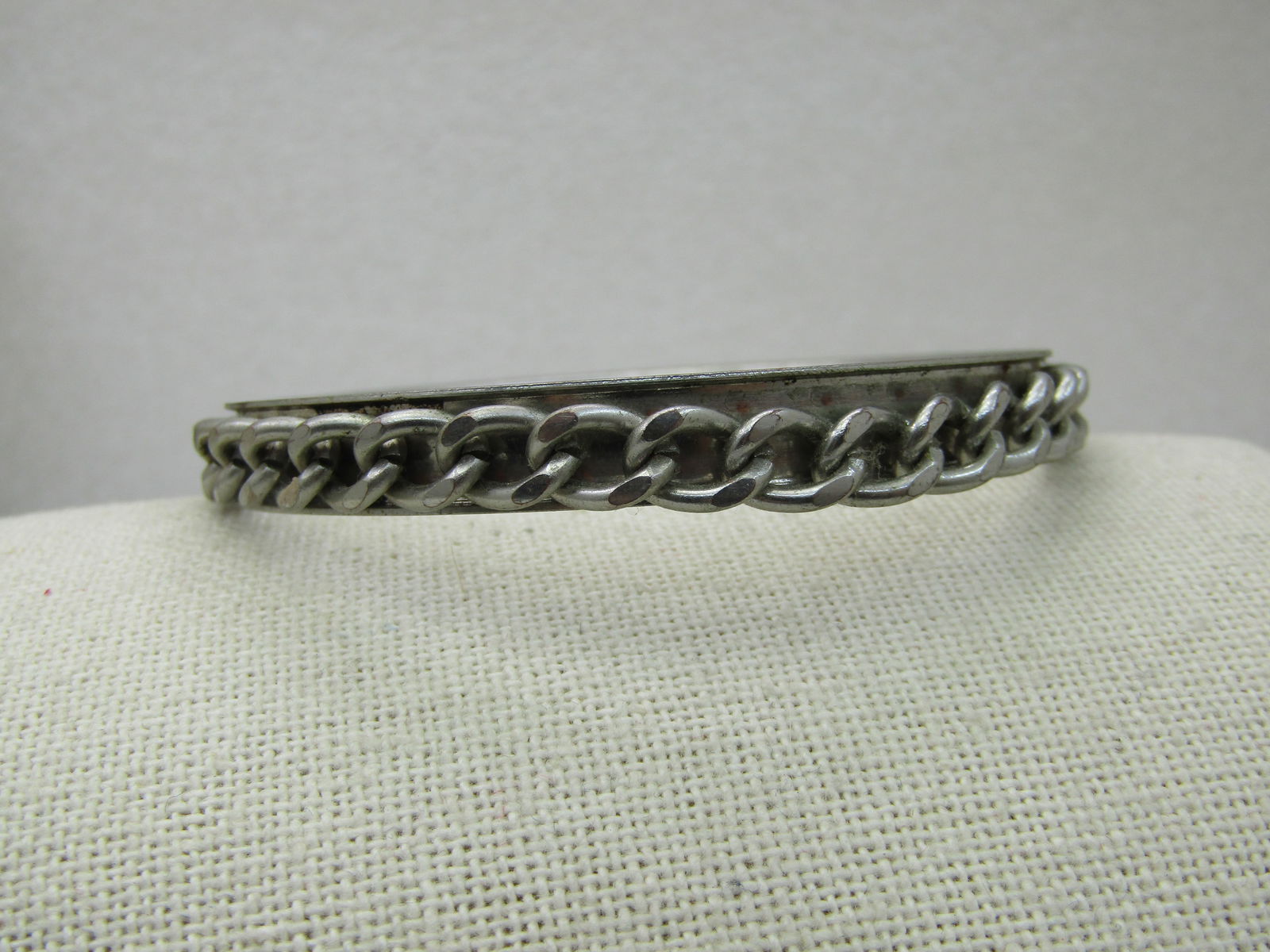 Vintage Curb Link Bangle Bracelet, 8.5", Silver Tone: Vintage Curb Link Bangle Bracelet, 8.5", Silver Tone, 8.5mm wide. 1980's-1990's. Silver tone recessed bangle bracelet with a curb link chain set in the recessed area. Opening is 2.75" and allows for m