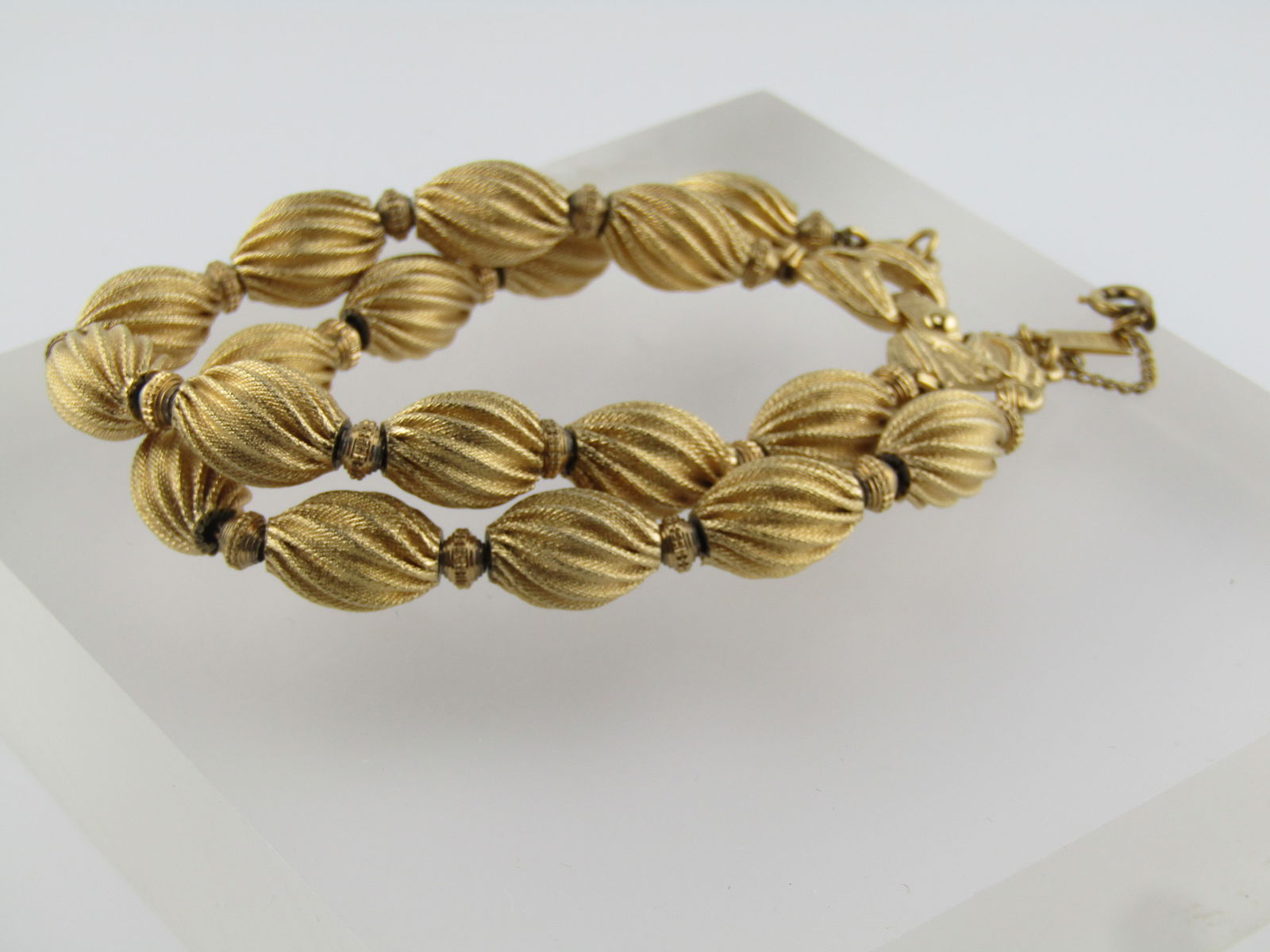 Vintage Spiral Beaded Bracelet, Monet, Double Strand, 7.5", 1960's-1970's: Vintage Spiral Beaded Bracelet, Monet, Double Strand, 7.5", 1960's-1970's. This has textured godl tone spiral beads with a ridged bead between each of the spiral beads. The spiral beads are appx. 9mm