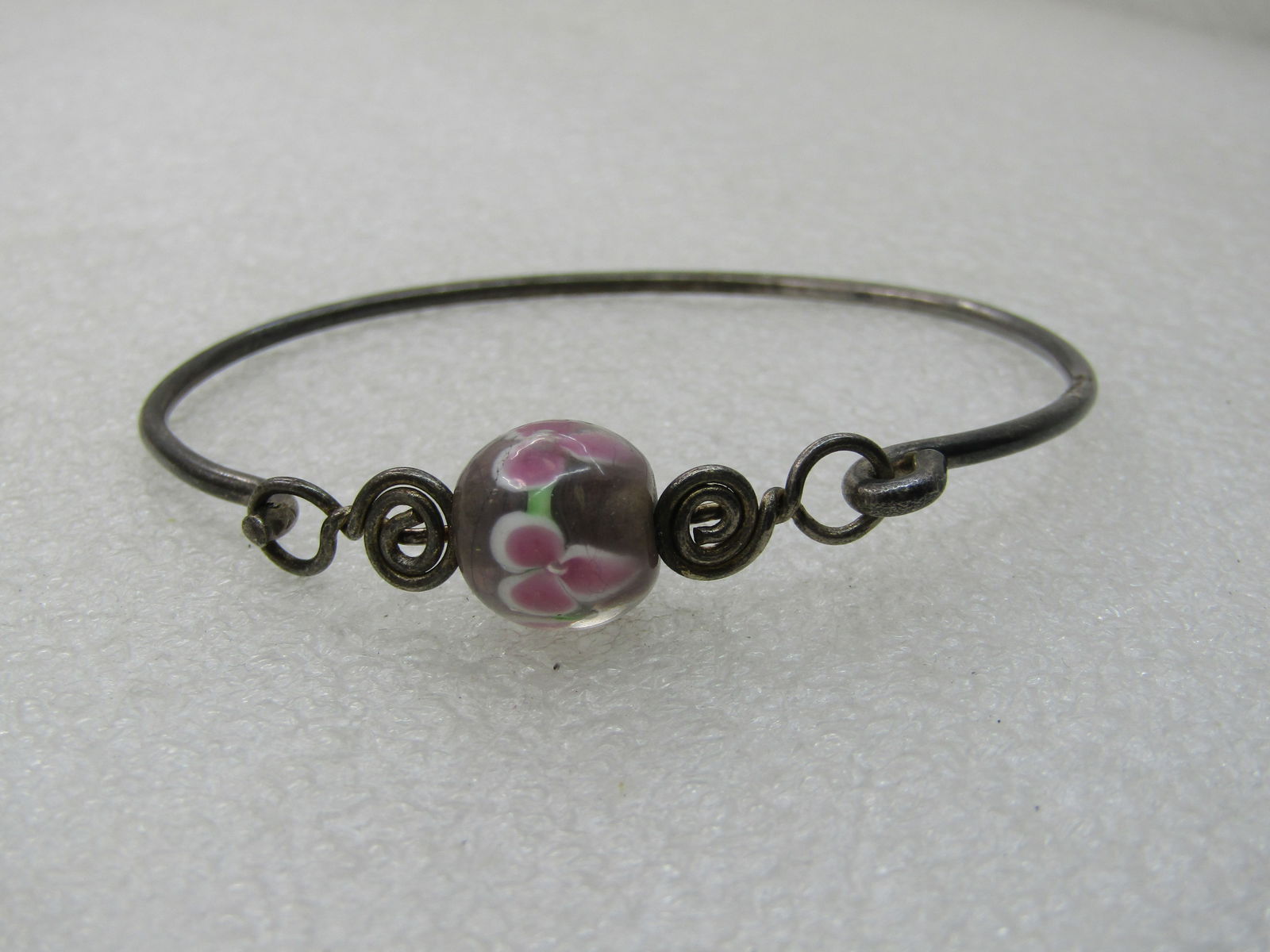 Vintage Sterling Floral Bead Bangle Bracelet, 7": Vintage Sterling Floral Bead Bangle Bracelet, 7", 12.5mm pink and white pansy/violet floral beaded with scrolled accents on each side. Attached at one side and a hook clasp on the other. It has a
