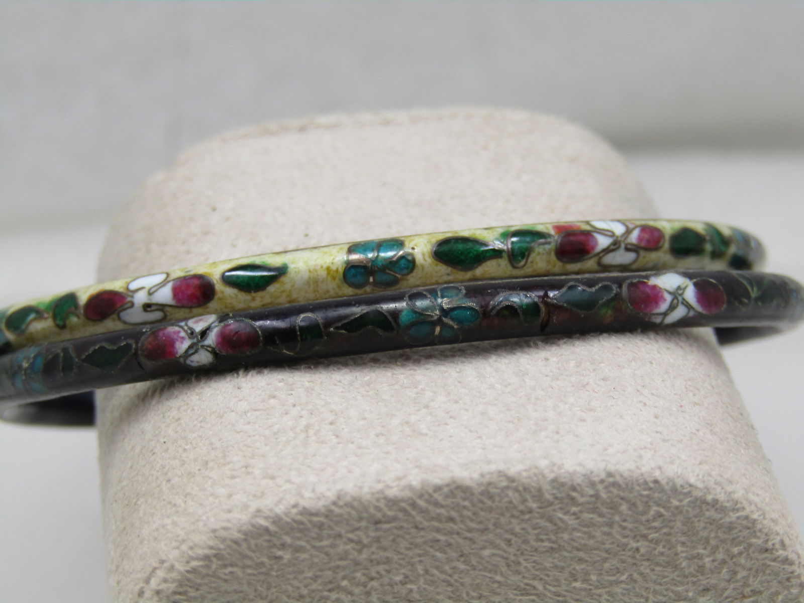 Two Vintage Cloisonne Bangle Bracelets, 8": Two Vintage Cloisonne Bangle Bracelets, 8" rounded and appx. 4mm. Both of dark blue enameling on the inside and one has dark blue on the outside with a floral design around the bracelet with white,