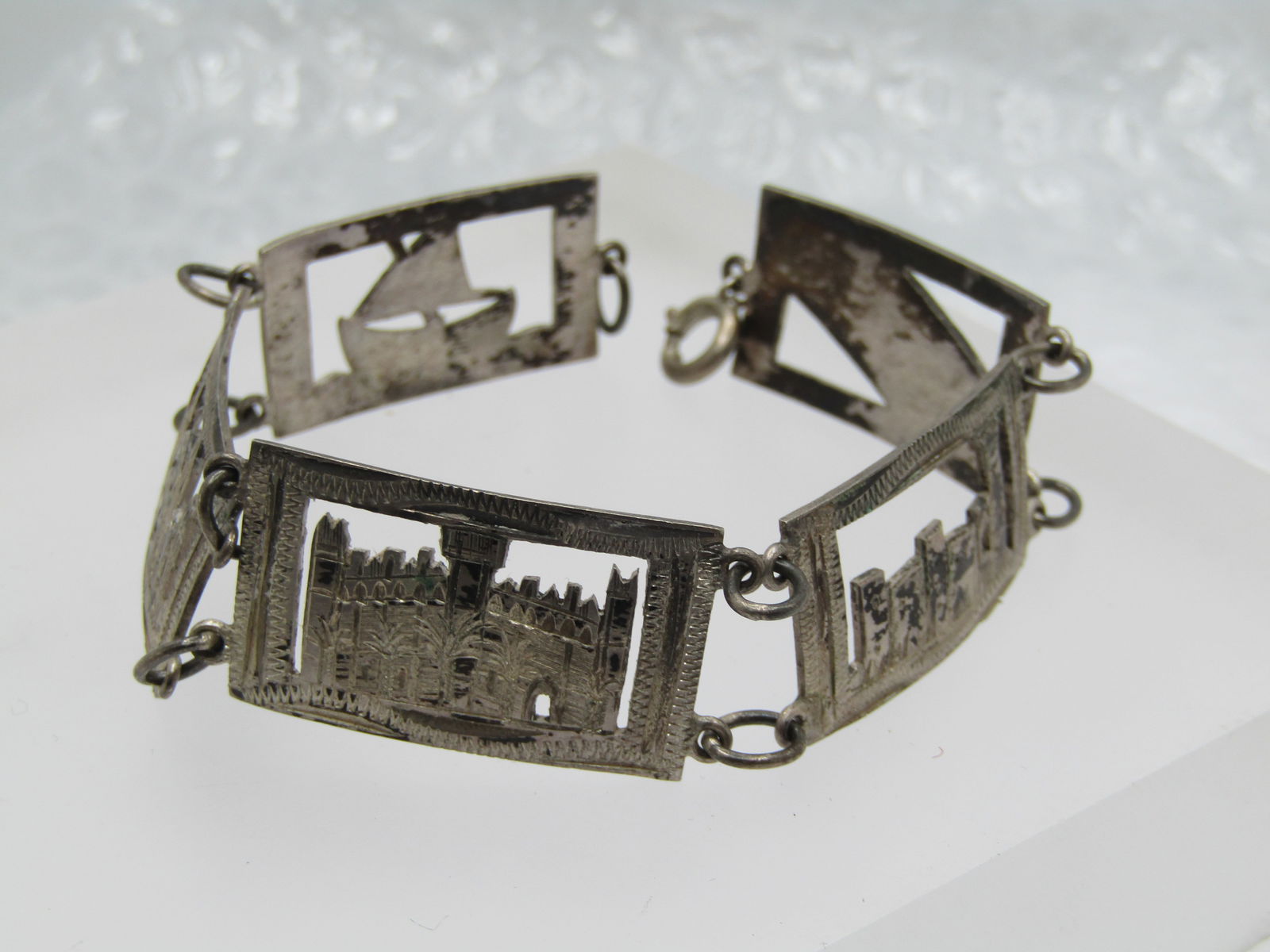 Vintage .800-.925 Silver Mallorca Spain Bracelet, 7.75", 1940's: Vintage .800-.925 Sterling Mallorca Spain Bracelet, 7.75", 1930's-1940's Five tiles with a cout-out design, a boat; church; building; town; and Mallorca. Spring Clasp. The links are appx. 3/4" tall an