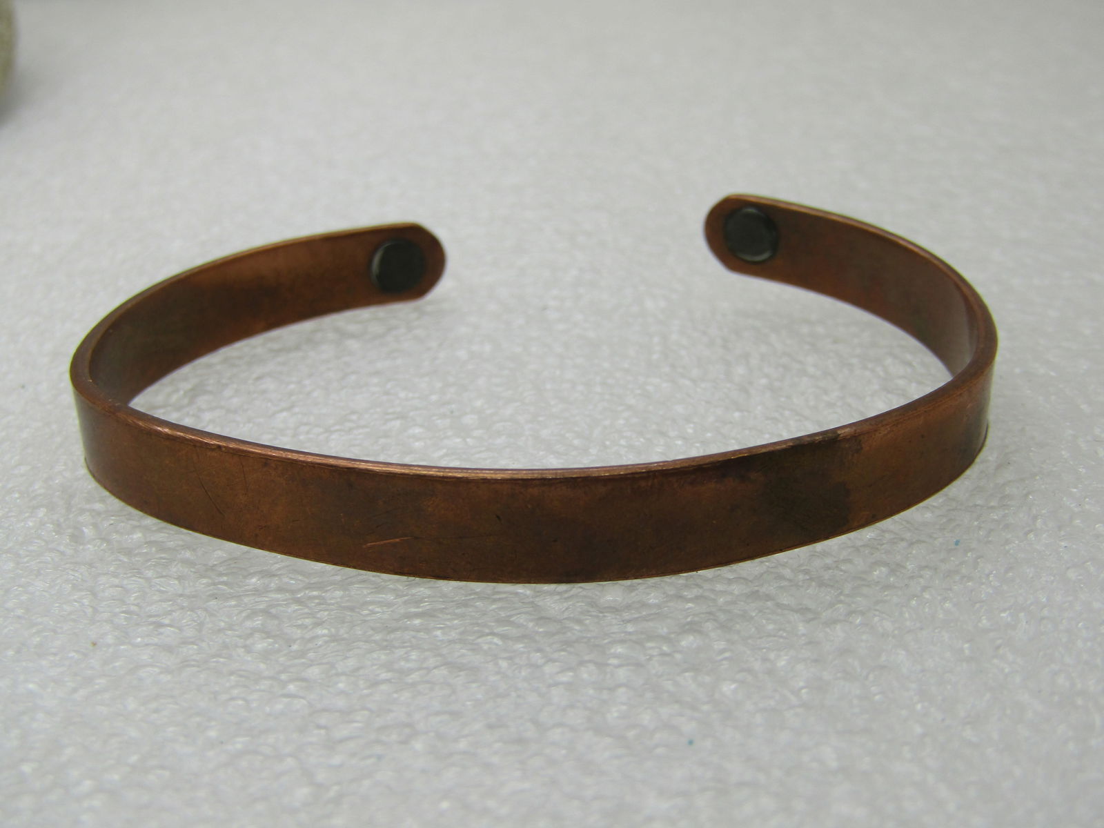Vintage Sabona Copper Cuff Bracelet, Magnetic, 7", 7.5mm wide NL: Vintage Sabona Copper Cuff Bracelet, Magnetic, 7", 7.5mm wide - unisex. 6" inside measurement with 1" opening. It does have some wear but is still in good condition. Slightly out of round from being w