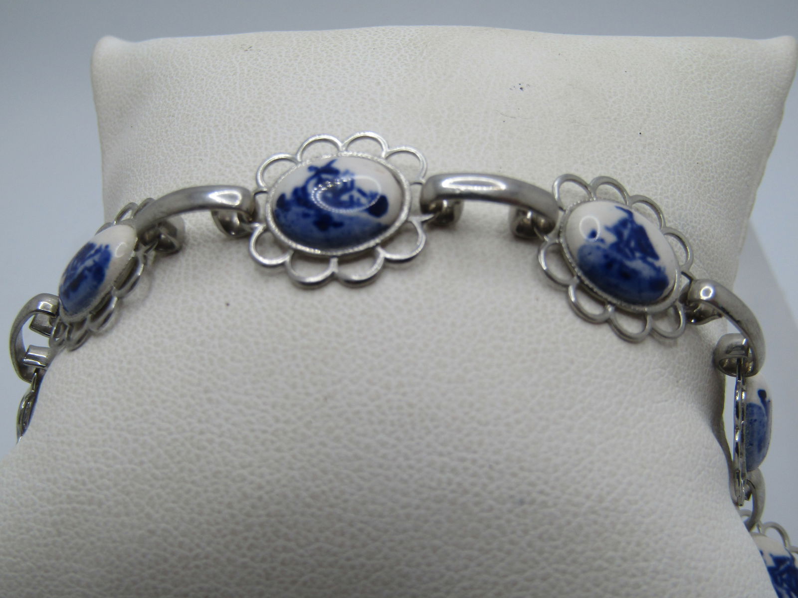 Vintage Blue Delft Style Bracelet, 7.75", 1960's: Vintage Blue Delft Style Bracelet, 7.75", 1960's. Seven oval links that are setin an open scalloped frame. The stones are white with the shades of blue windmill scene. Appears to be ceramic or