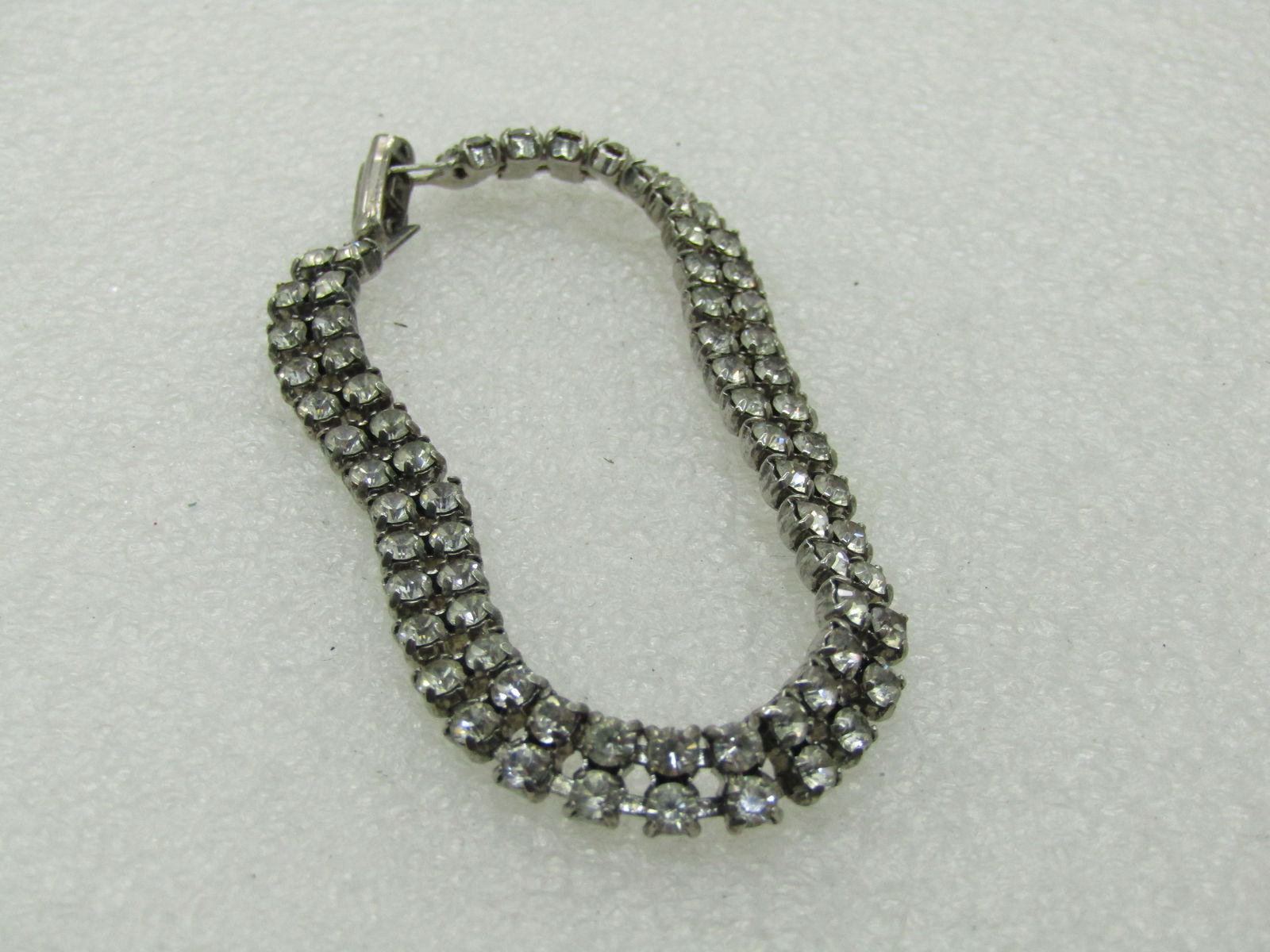 Vintage Art Deco Style Rhinestone Bracelet, Double Row, 7", 1960's: Vintage Art Deco Style Rhinestone Bracelet, Double Row, 7", 1960's. 6.6mm wide. Silver tone. Good to very good condition. Stones are clear. Not signed by the maker. (INV. W.27-30.15.1X1 SS2558 LD