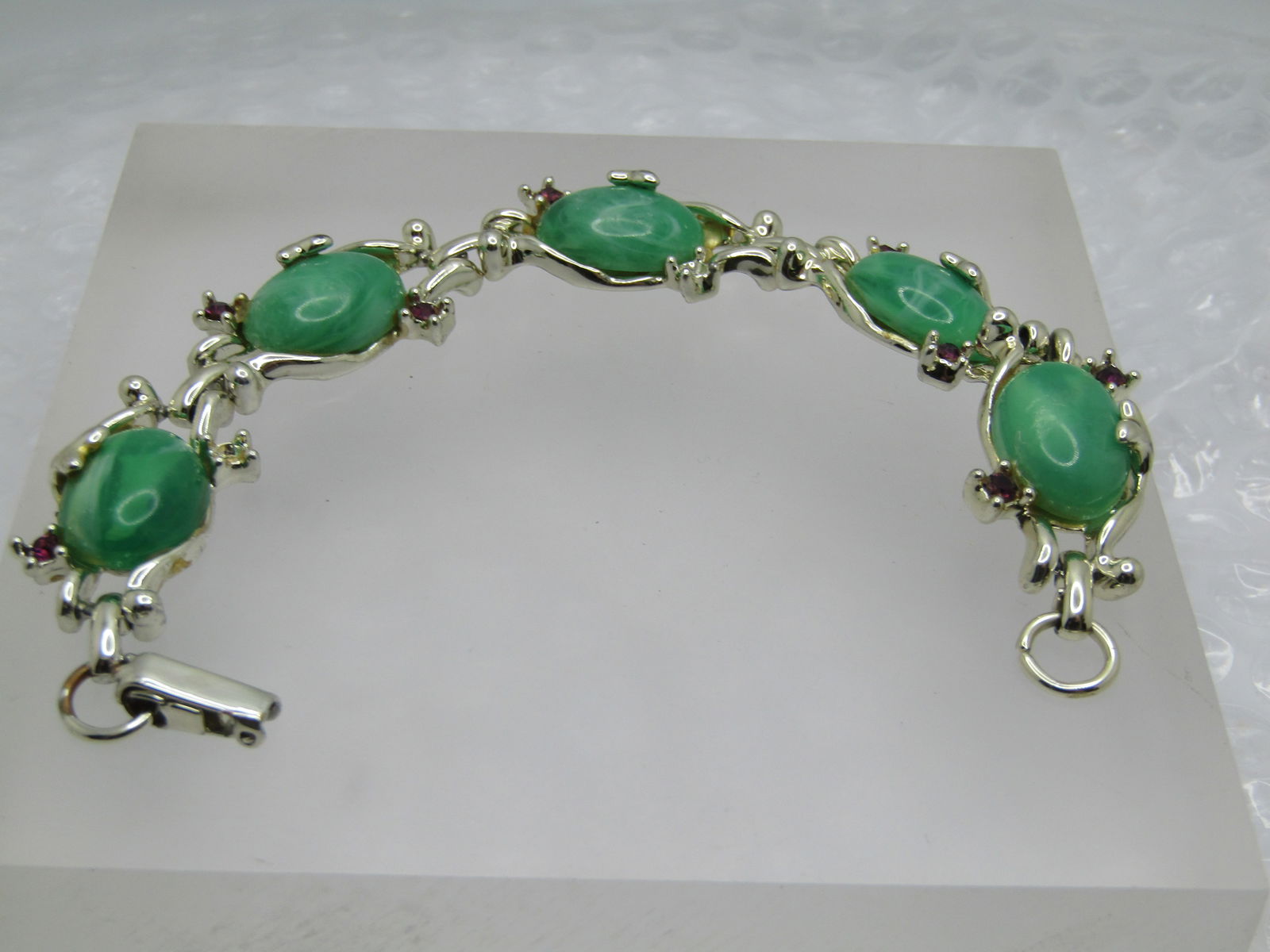 Vintage Faux Jade & Amethyst Bracelet, 7.5", 1940's-1950's: Vintage Faux Jade & Amethyst Bracelet, 7.5" long and apx. 5/8" wide, 1940's-1950's, Gold tone five ink bracelet with five faux jade cabochons that are appx. 17mm by 12mm in a scrolled setting with