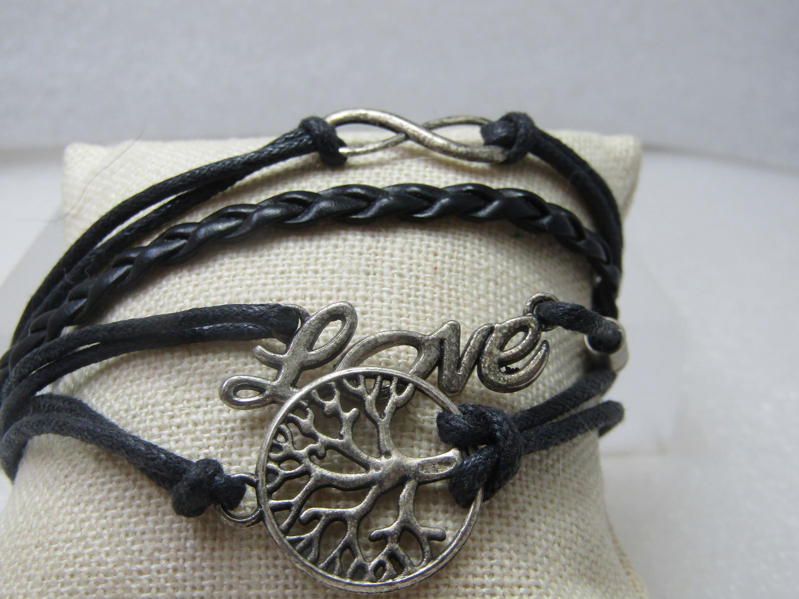Vintage Love, Infinity, Family Multi-strand Bracelet. 8" Plus: Vintage Love, Infinity, Family Multi-strand Bracelet. 8" Plus Extender Chain. Vintage multi strand bracelet infinity love family tree center charms - seven strands braided black cord - appx 1-1/2