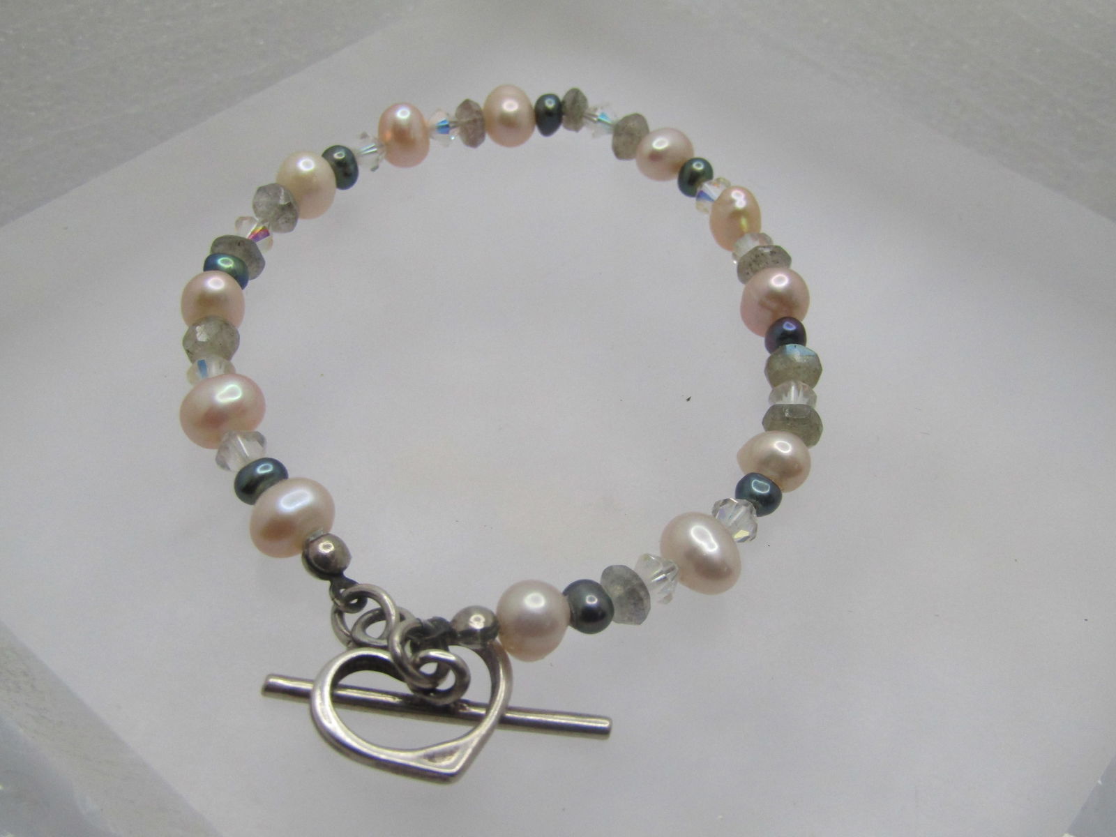 Vintage Sterling Baroque Pearl/Crystal Bracelet, Toggle Clasp, 7.75": Vintage Sterling Baroque Pearl/Crystal Bracelet, Toggle Clasp, 7.75". The pearls are a baroque freshwater pearl, potato shaped and average appx. 6.5mm wide with clear crystal faceted beads of