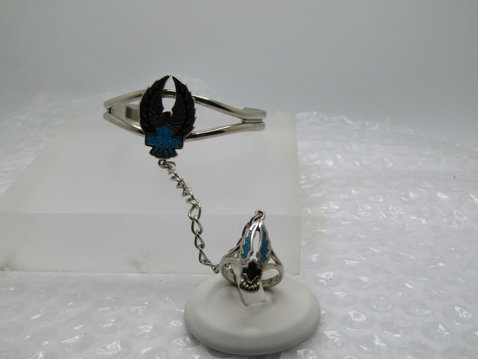 Vintage Enameled & Turquoise Chip Biker Bracelet with Attached Ring, 7" and Sz. 5.75: Vintage Enameled & Turquoise Chip Biker Bracelet with Attached Ring, chain is 3.5" from bracelet to ring. Bracelet is 7". Ring is Sz. 5.75. Slave Bracelet/Ring. This is made with a silver tone metal