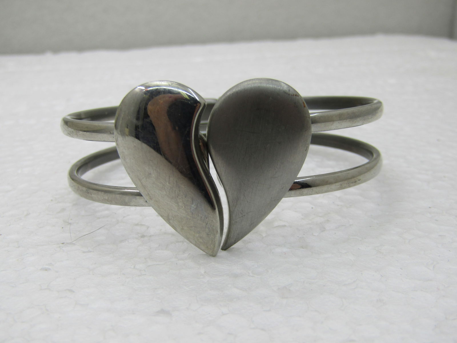 Vintage Premier Designs Heart Clamper Bracelet, 7", Silver Tone: Vintage Premier Designs Heart Clamper Bracelet, 7", Silver Tone. Divided heart on top, half smooth and shiny and half brush finished. The heart isappx. 1" by 1.25" wide. It sits on the top of the wris