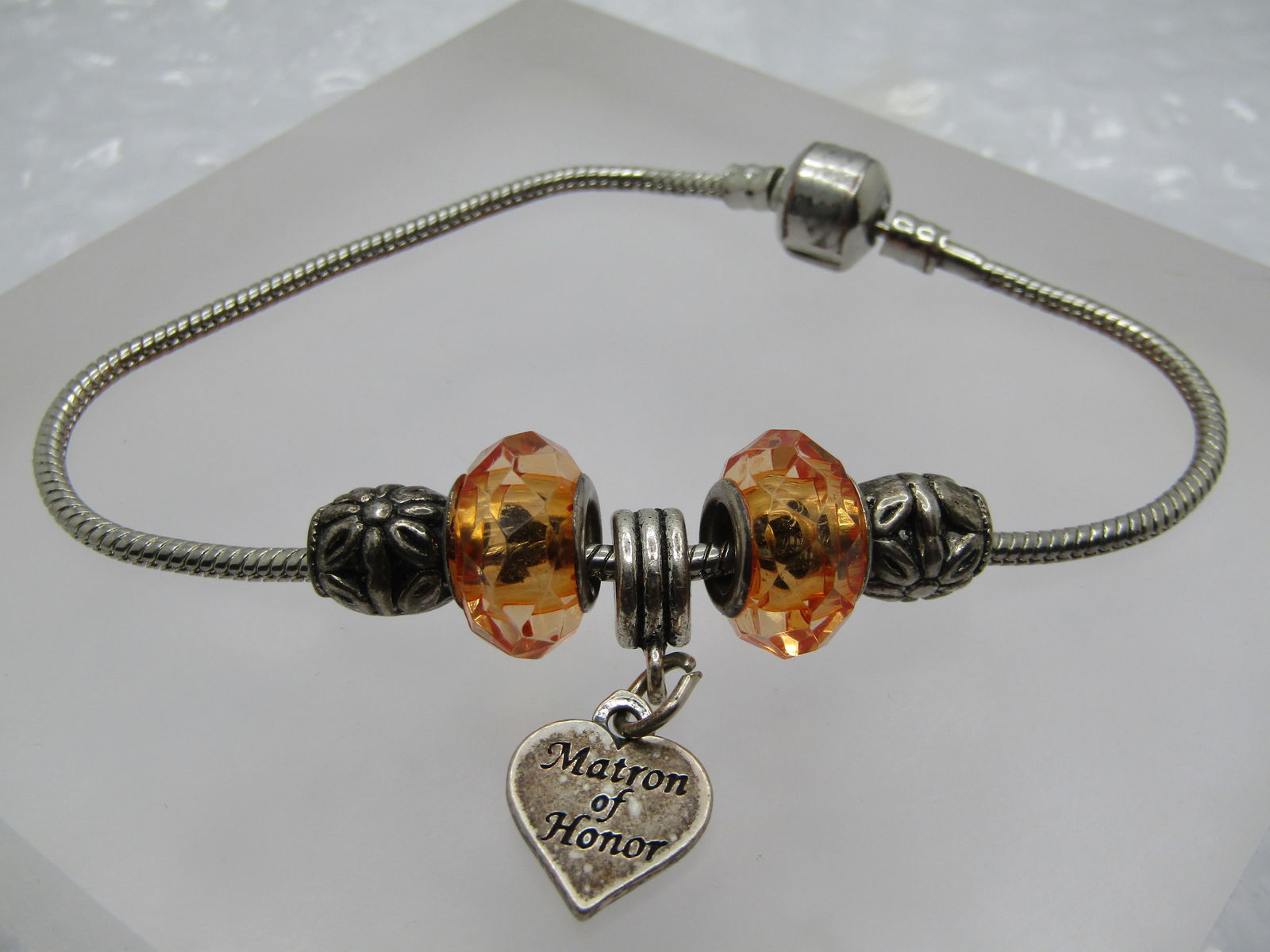 Sterling Matron of Honor Slide Bracelet, 8.5", Snake Chain: Sterling Matron of Honor Slide Bracelet, 8.5", Snake Chain. There is a slide charm, heart shaped, Matron of Honor, marked sterling and tested The remainder of the bracelet is silver tone - it has