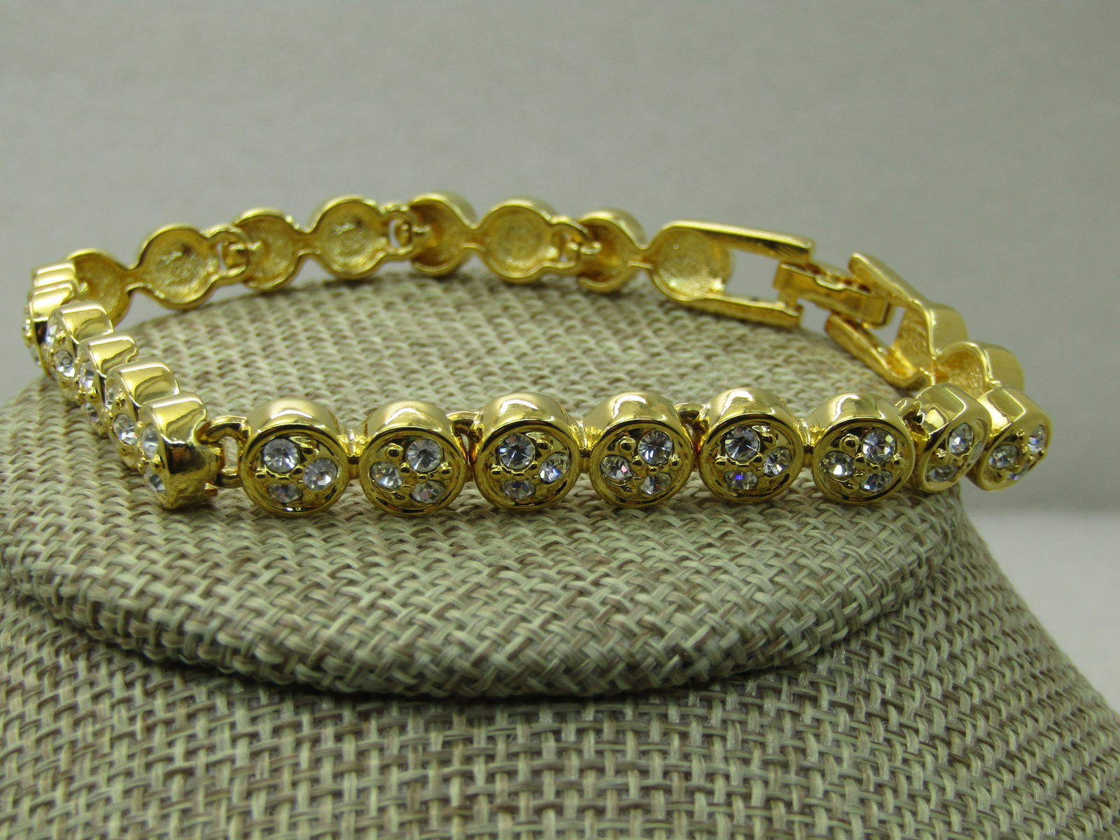 Vintage Joan Rivers Clear Crystal Tennis Bracelet, 8", Round Links: Vintage Joan Rivers Clear Crystal Tennis Bracelet, 8", Round Links, 7.5mm wide, flip clasp. Tall 3.9mm high round links with three clear stones in each link. Very good condition. Signed Joan Rivers. (