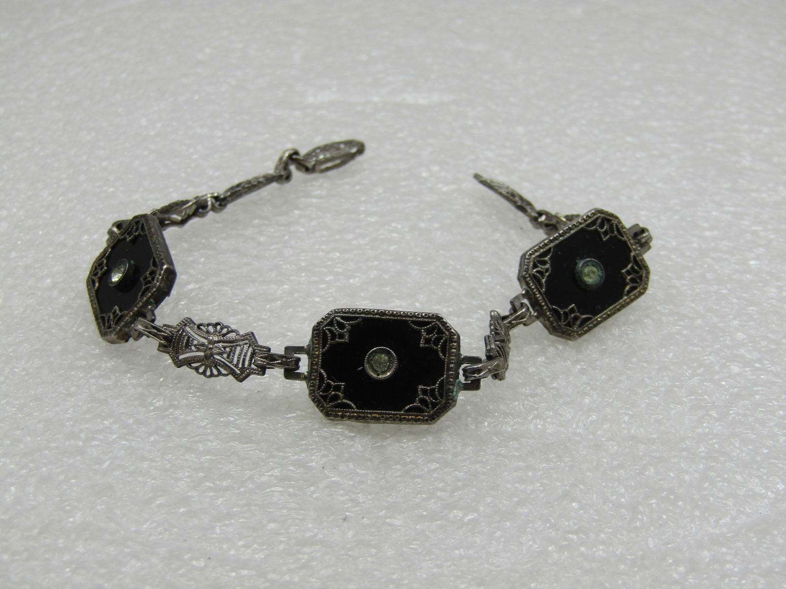 Vintage Sterling Art Deco Black Glass Filigree Bracelet, 7": Vintage Sterling Art Deco Black Glass Filigree Bracelet, 7" long and 12.5mm wide. Weight is appx. 6.63 gr. It is not marked or signed but tested multiple times and does test as sterling. It has tghree