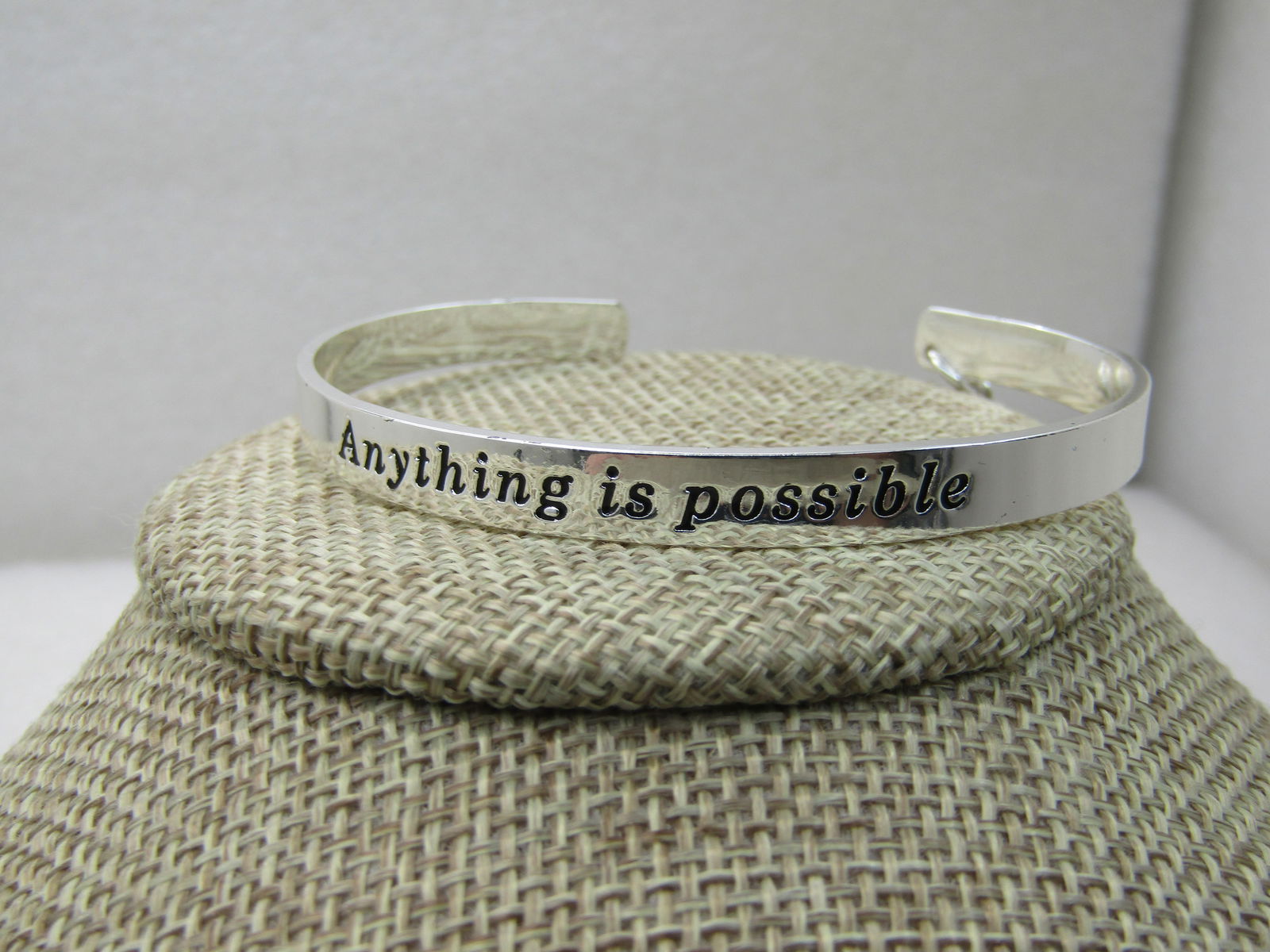 Avon My Truth Charm Cuff Bracelet, Rhinestone Cross Anything is Possible, 7": Avon My Truth Charm Cuff Bracelet, Rhinestone Cross Anything is Possible , 7", 2015 and new in box. Appx. 6mm wide with a 3/4 rhinestone cross dangling on one side of the back of the bracelet. New and