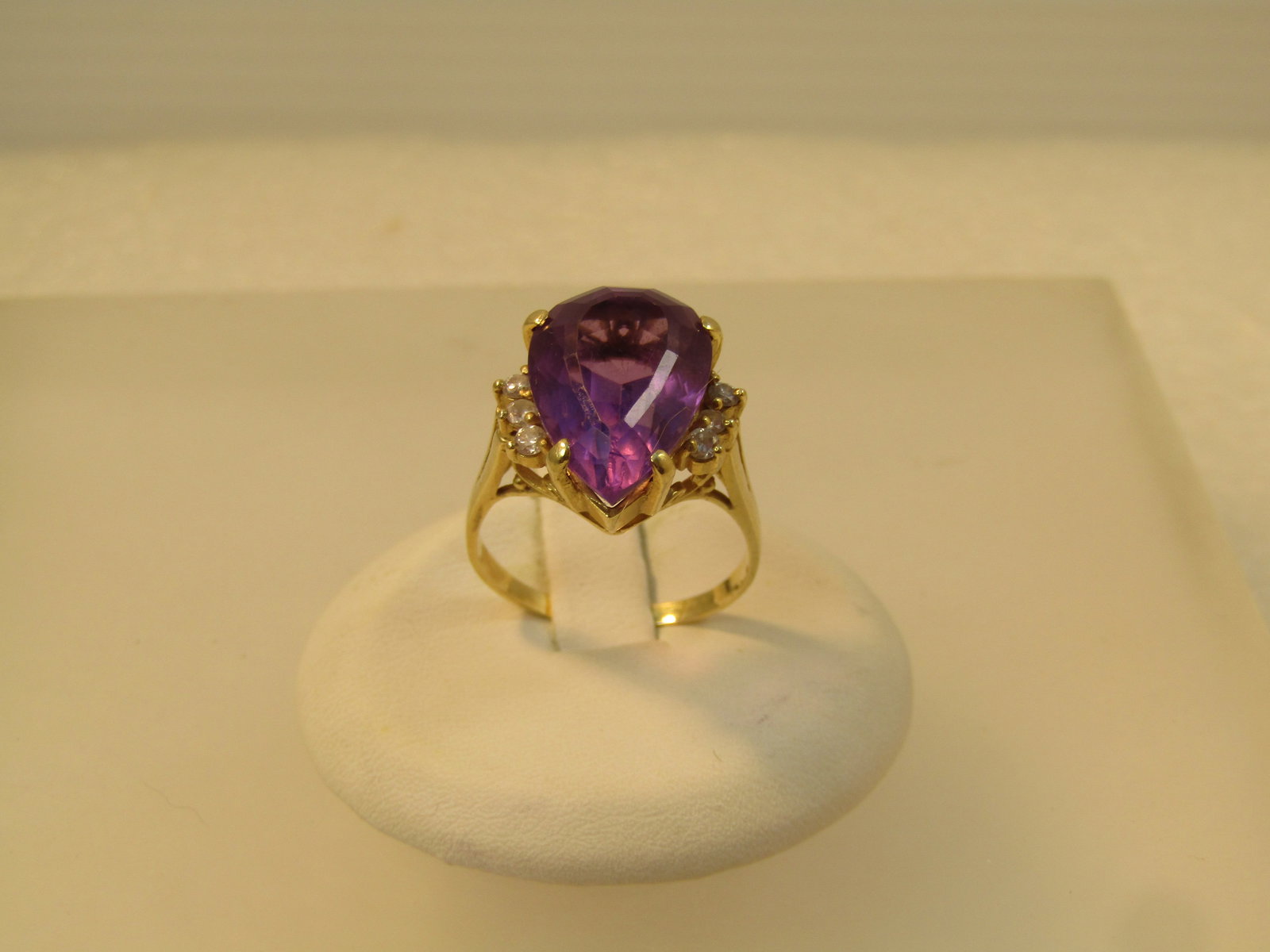 Vintage 14kt Amethyst Diamond Ring, 6 CTW Sz. 7, 1970's-1980's: Vintage 14kt Amethyst Diamond Ring, 6.41 CTW Sz. 7, 1970's-1980's. Amethyst pear-shaped stone that is appx. 16mm by 10.5mm and 8mm thick. This is appx. 6.41 tcw. There are three diamonds on each