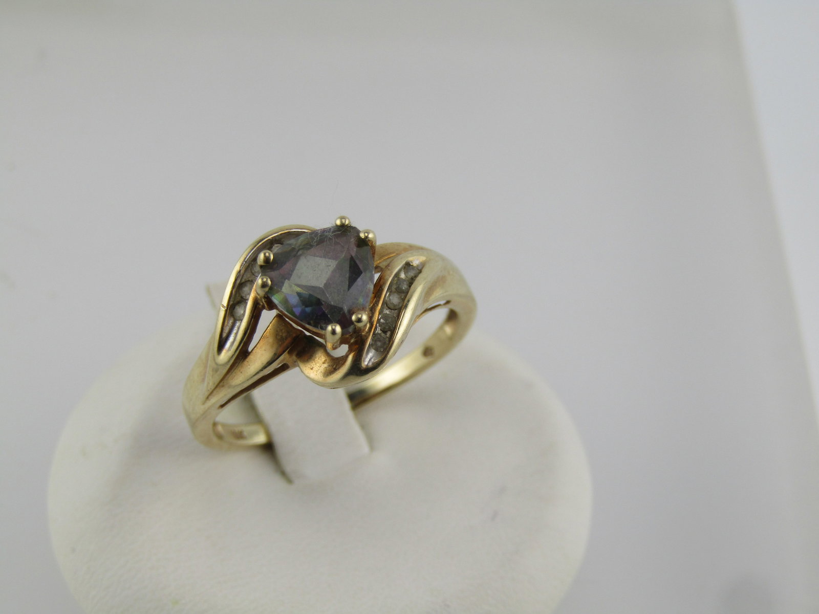 Vintage 10kt Mystic Topaz Diamond Ring, Sz. 9.5, Signed, 1980's: Vintage 10kt Mystic Topaz Diamond Ring, Sz. 9.5, Signed, 1980's. This is 10kt yellow gold, with a bypass design, with a triangular cut mystic topaz that is appx. 7mm down each side with cut