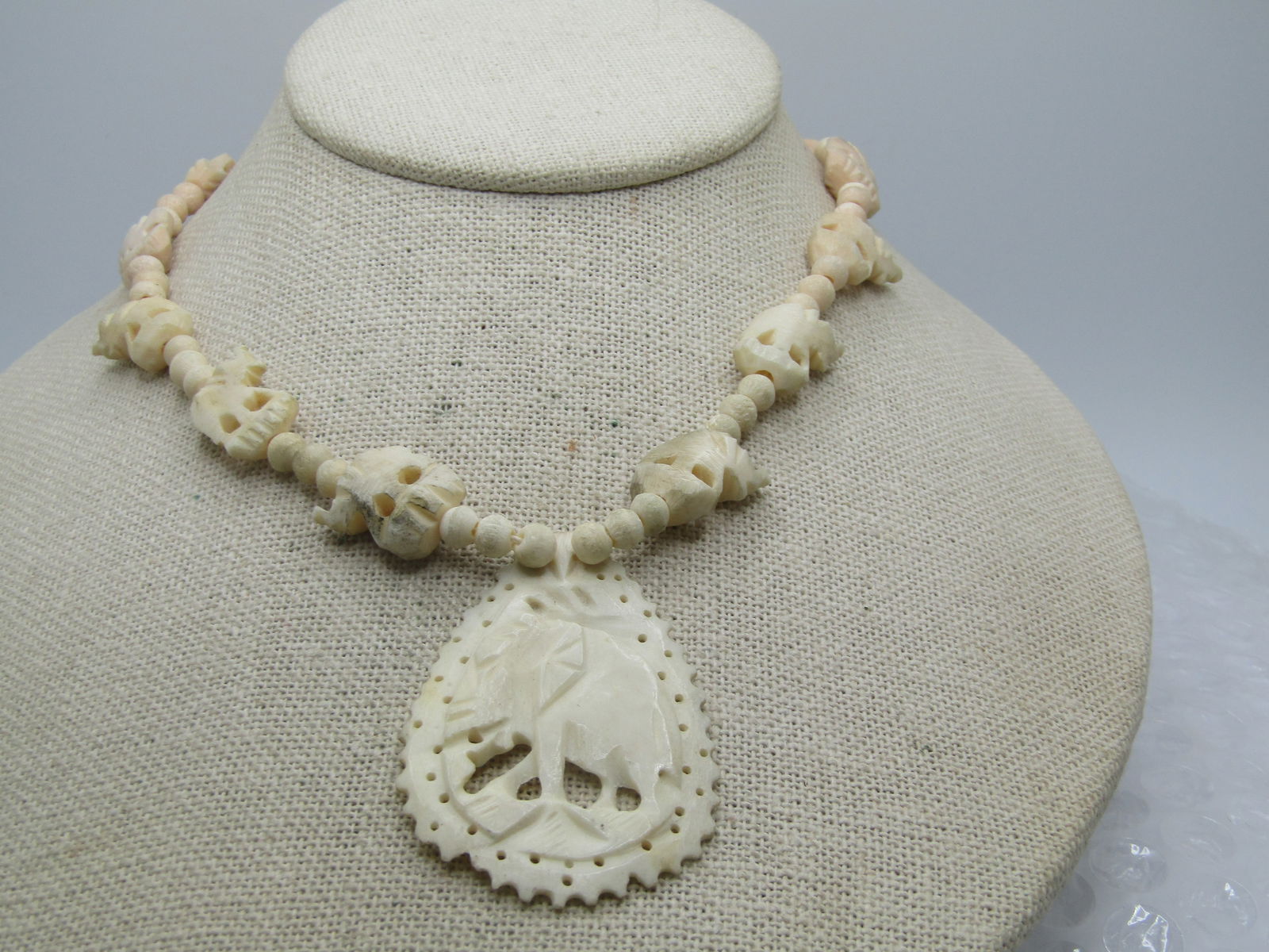 Vintage Carved Elephant Necklace, 19", Made in India, Vintage New Stock: Vintage Carved Elephant Necklace, 19", Made in India, Vintage New Stock. This has a carved barrel clasp and round beads that are appx. 5mm wide with carved elephants in the chain thatr are appx 1/2"