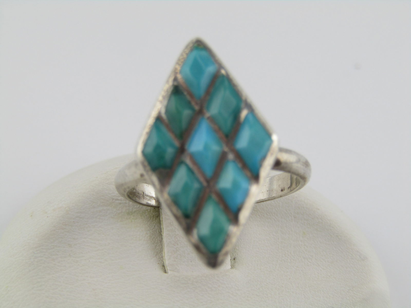 Vintage Sterling Southwestern Inlaid Turquoise Ring, Sz. 6, Pointed, 1970's-1980's: Vintage Sterling Inlaid Turquoise Ring, Sz. 6, Pointed, 1970's-1980's. Southwestern. This is an elongated pointed sterling ring with nine inlaid sections of turquoise that are cut in the same shape