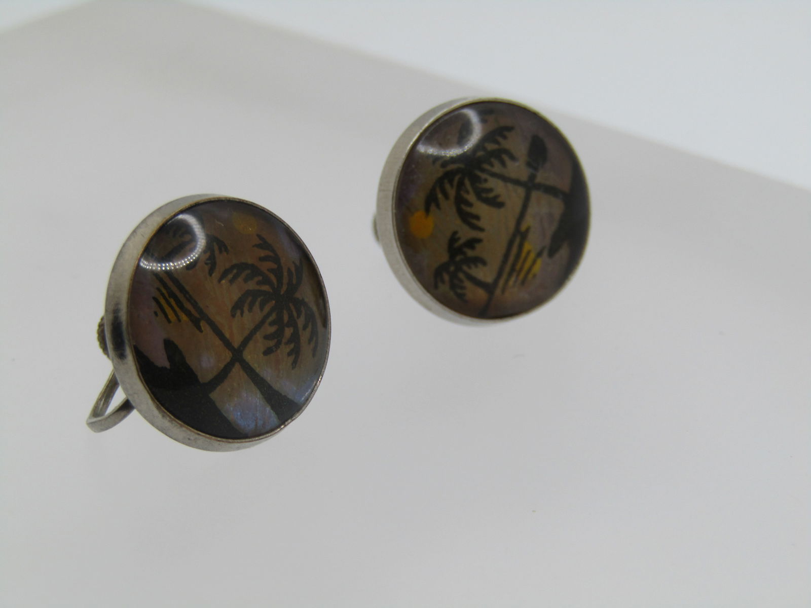 Vintage Morpho Beach Scene Earrings, Screwback, 1950's-1960's: Vintage Morpho Beach Scene Earrings, Screwback, 1950's-1960's. Butterfly wings in the background and a beach scene in the front. 3/4" round, slightly domed. Silver tone metal. Not signed or