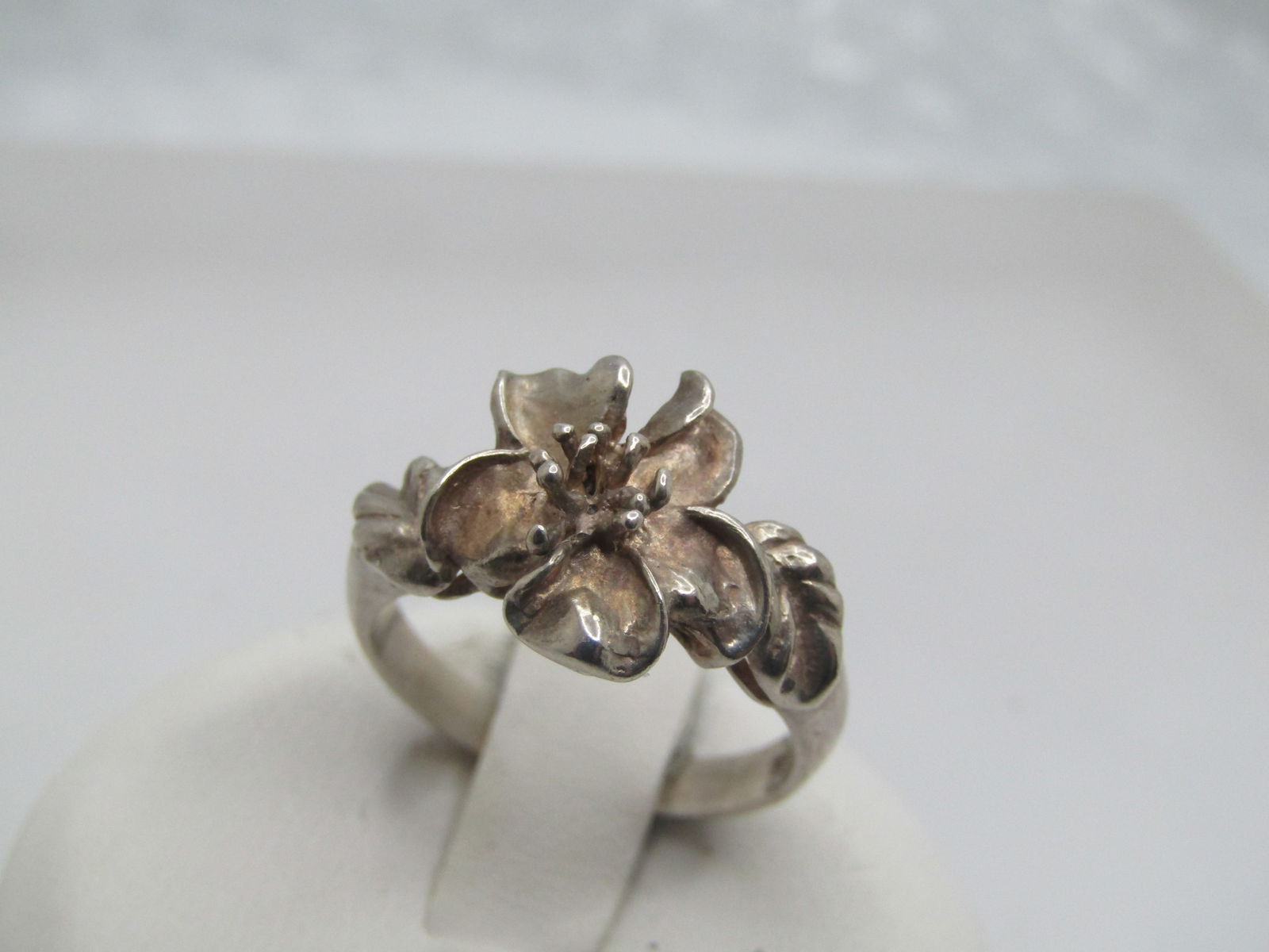 Vintage Sterling Floral Blossom Ring, Sz. 6, 1980's-1990's: Vintage Sterling Floral Blossom Ring, Sz. 6, 1980's-1990's. I am not sure what the blossom is - could be plumeria or pansy - it has the illusion of having a center stone but it is raised prong-like