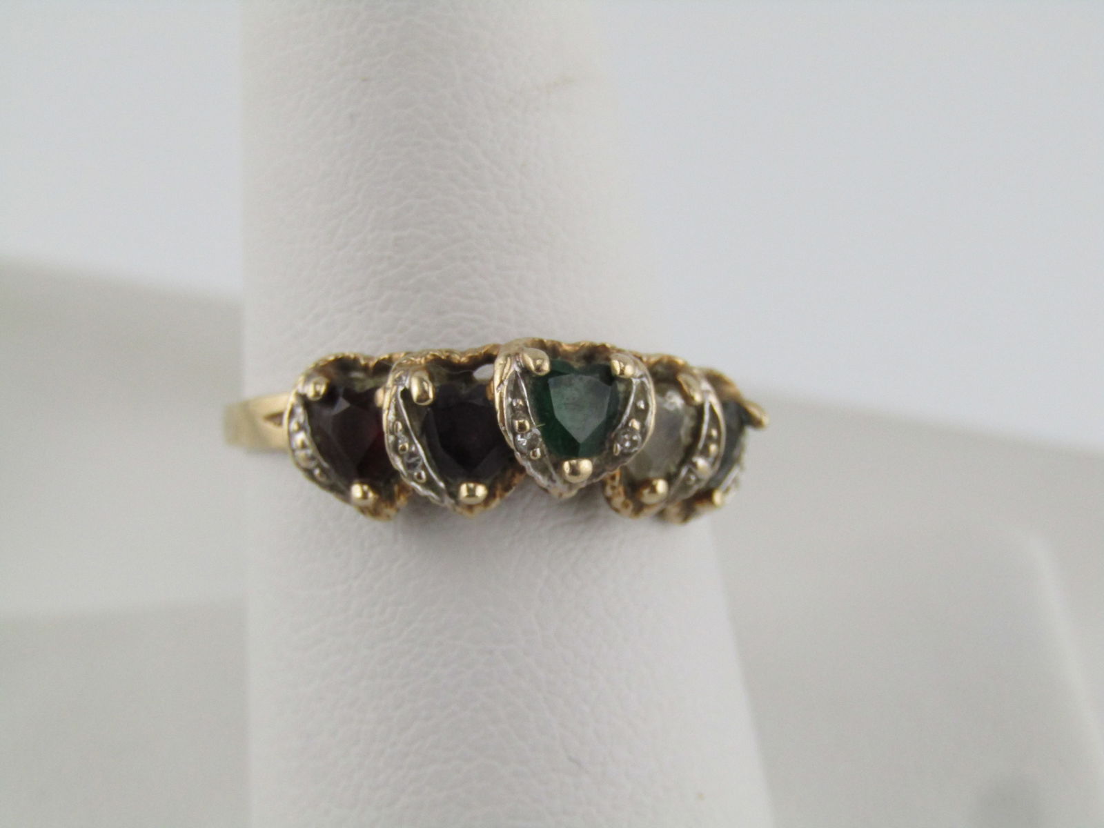Vintage 10kt Tiered Gemstone Heart Ring, Sz. 9. Signed AAJ. 1960's-1970's: Vintage 10kt Tiered Gemstone Heart Ring, Sz. 9. Signed AAJ. 1960's-1970's. This is possibly a mother's ring but that is not what first popped into my mind when I saw it. Great sweetheart ring too. 10k