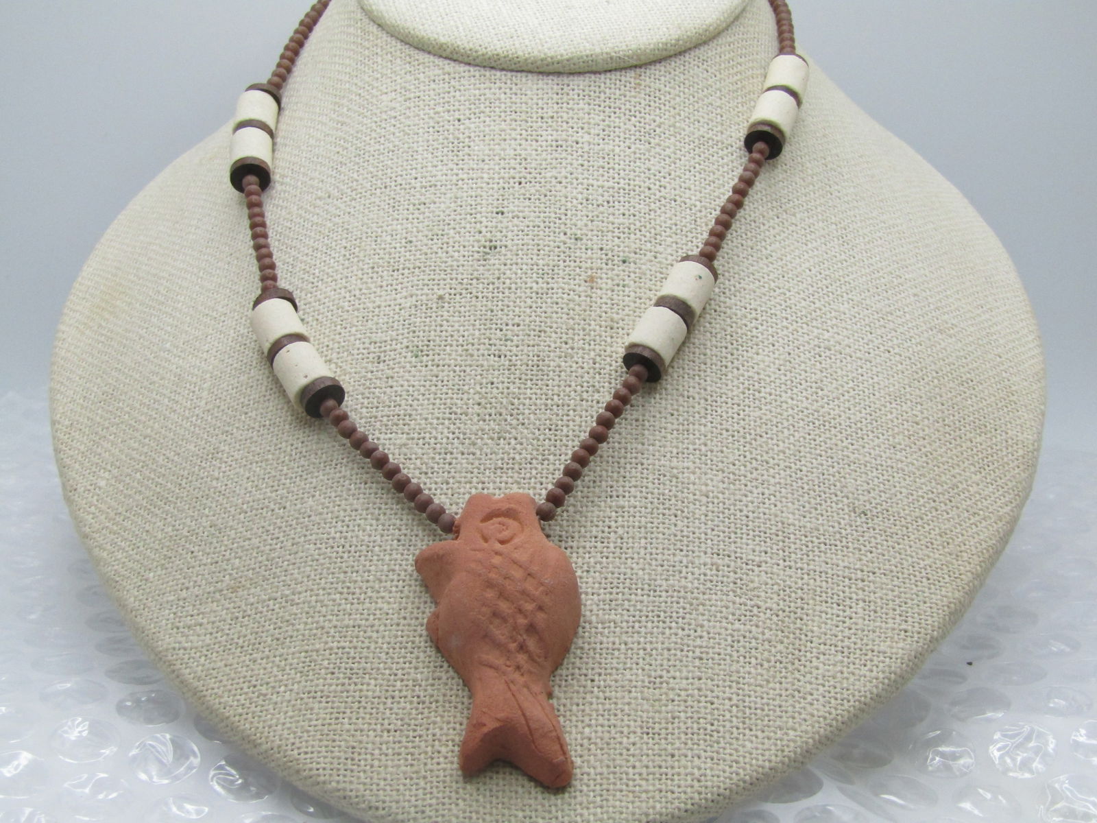 Vintage Terracota Fish, Bisque Beaded Necklace, 16" - Tribal Themed: Vintage Terracota Fish, Bisque Beaded Necklace, 16". Tribal themed. The fish is the pendant ande appx. 2" long and 1" wide. Hand made puffy fish with white bisque beads and brown beads that are appx.