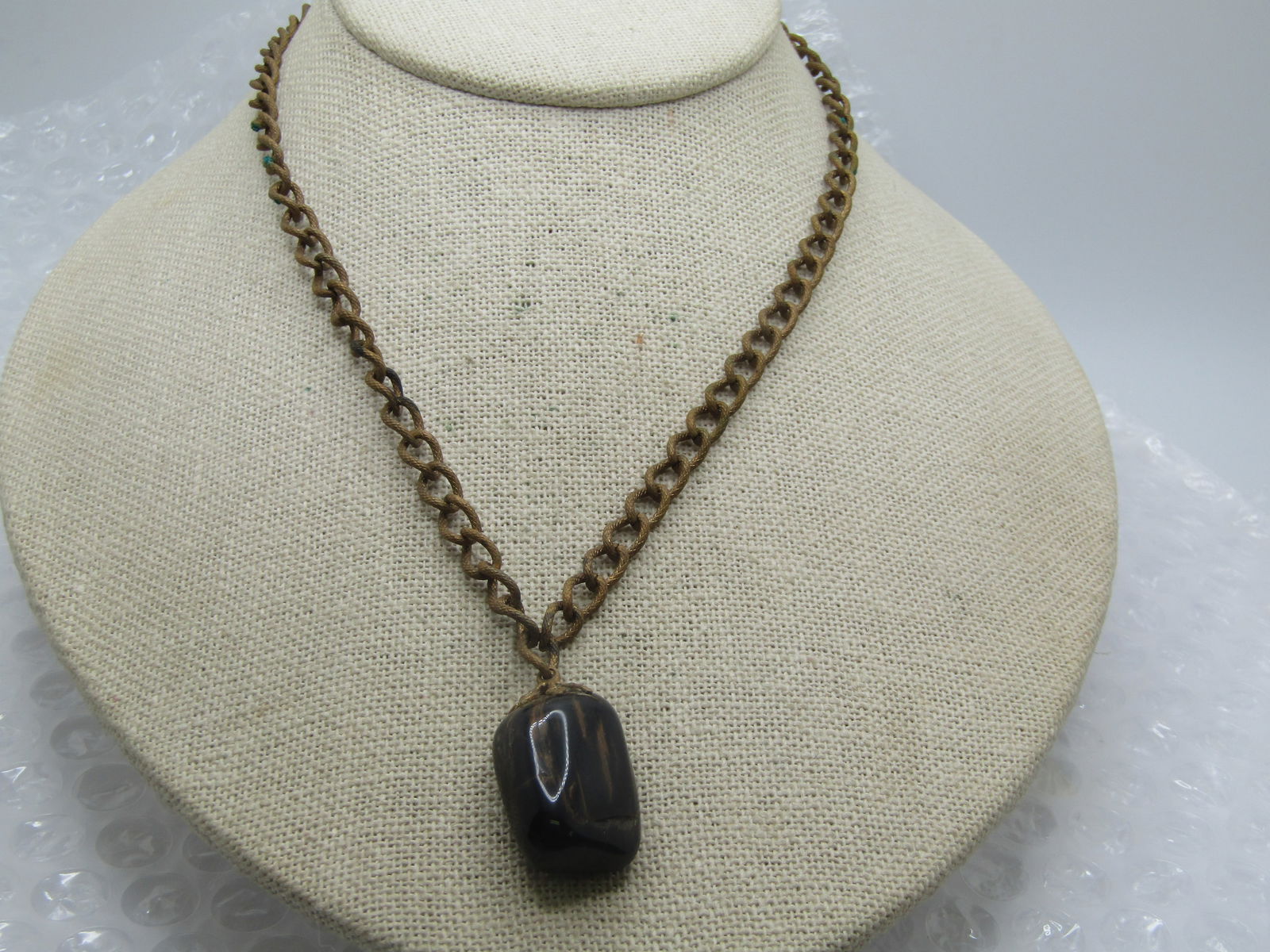 Vintage 1920's-1930's Petrified Wood Necklace, 16": Vintage 1920's-1930's Petrified Wood Necklace, 16". This has a textured brass tone chain that is 16" long with a filigree box clasp and is appx. 5.5mm wide. It has a dull rough finish as the