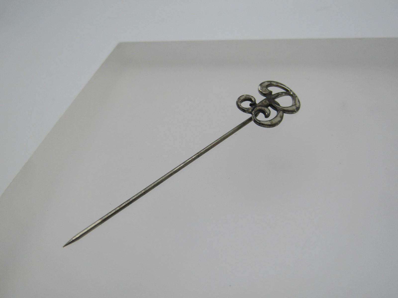 Vintage Sterling Initial B Stick Pin, 1940's: Vintage Sterling Initial B Stick Pin, 1940's. It is signed Sterling with a B in front of it. The B is sterling the pin is not. The length of the pin is appx. The B is a Scrolled B that is appx.