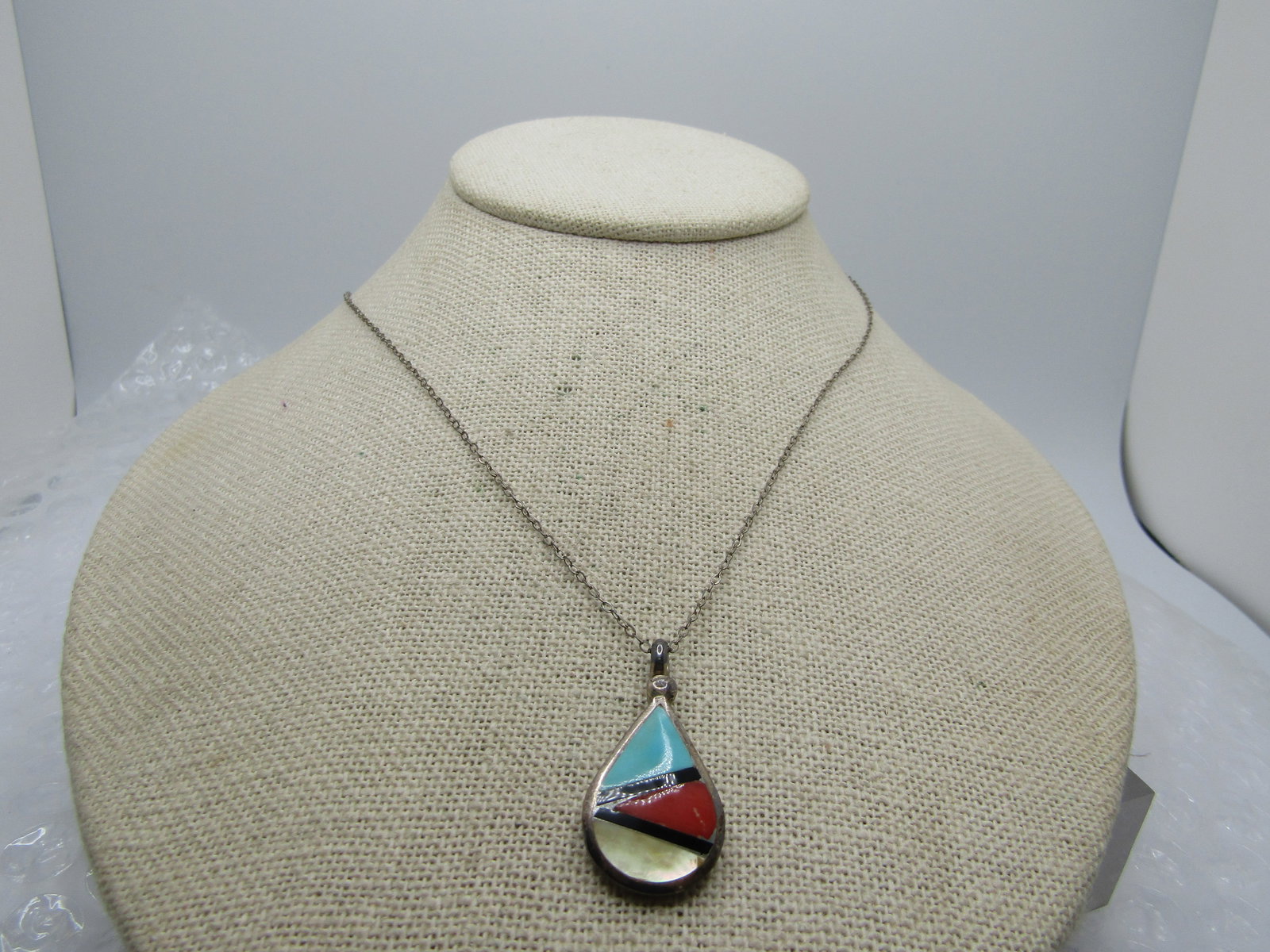 Vintage Inlaid Sterling Southwestern Turquoise/MOP/Red Necklace , 19".: Vintage Inlaid Sterling Southwestern Turquoise/MOP/Red Necklace , 19". The pendant is teardrop shaped with inlaid turquoise, red (coral/spiny oyster?), and mother-of-pearl with black (possibly onyx) l