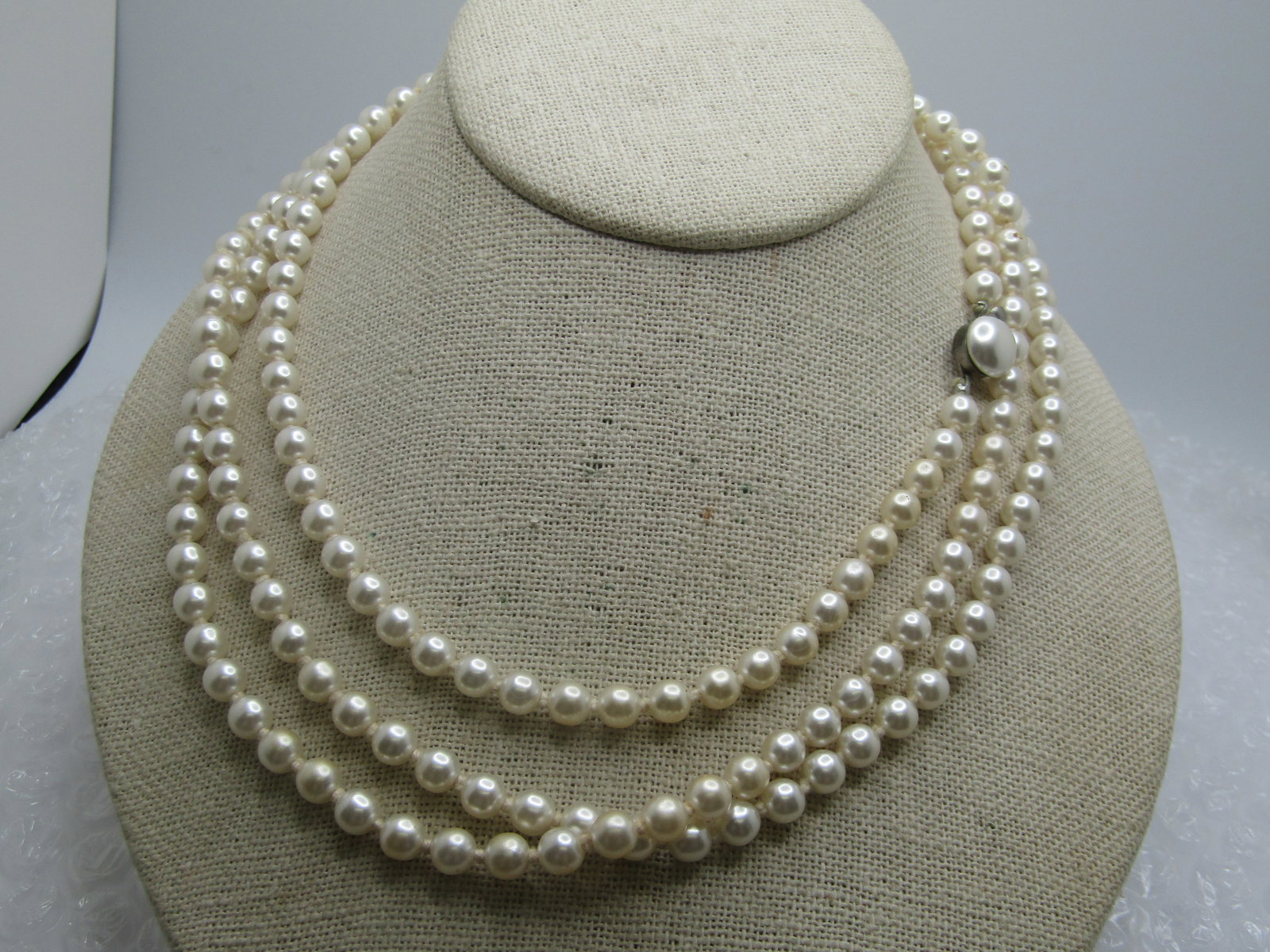 Vintage 54" Faux Pearl Necklace, 5.5mm, 1950's-1960's: Vintage 54" Faux Pearl Necklace, 5.5mm, 1950's-1960's. It is knotted between each pearl. They are a white luster. There is one knot that has a visible thread which I did get in one or two photos. It i