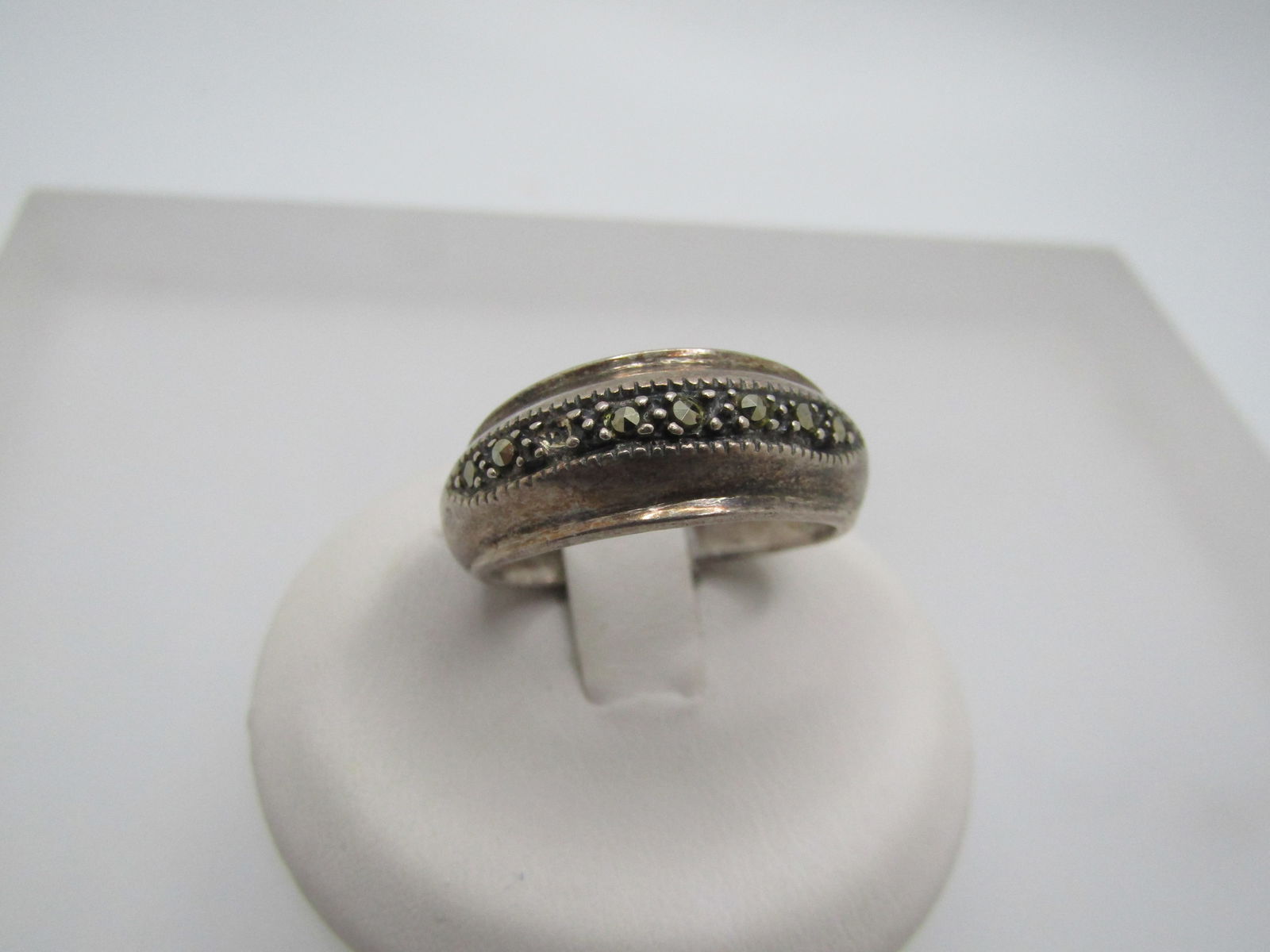 Vintage Sterling Marcasite Domed Band Ring, Sz. 7.25, Unisex, 1970's-1980's: Vintage Sterling Marcasite Domed Band Ring, Sz. 7.25, Unisex, 8.5mm wide on top and tapers to appx. 3mm at the back of the finger. This has marcasites set in a prong-like setting, stones are glued. On