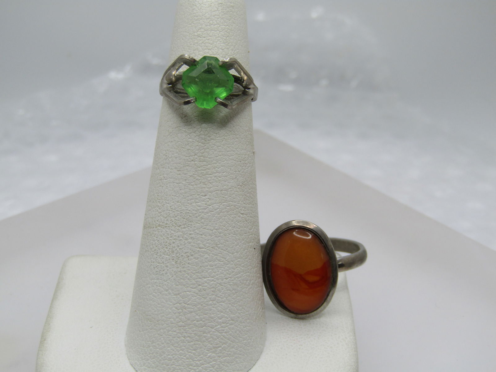 Vintage Sterling Green Stone Sz. 4 Ring, and Adjust Costume Ring: Vintage Sterling Green Stone Sz. 4 Ring, and Adjust Costume Ring. The green stone ring is a square stone, set on the point which have cut-corners. The stone is appx. 8mm across set in a pseudo pyramid