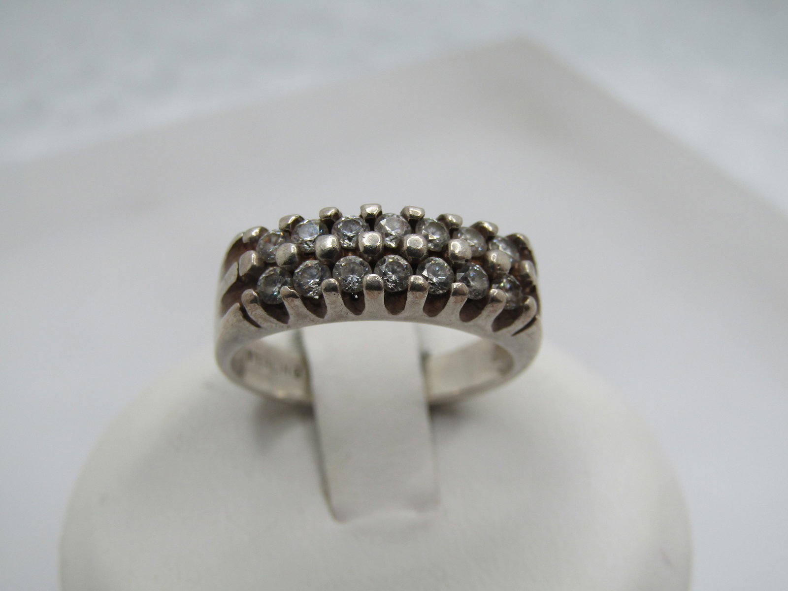 Vintage Sterling Double Row CZ Ring, Sz. 6, Signed: Vintage Sterling Double Row CZ Ring, Sz. 6, Signed with an unknown maker's mark pictograph. Weight of the ring is 3.68. It is marked sterling and tests as sterling. Great as anniversary band too. The