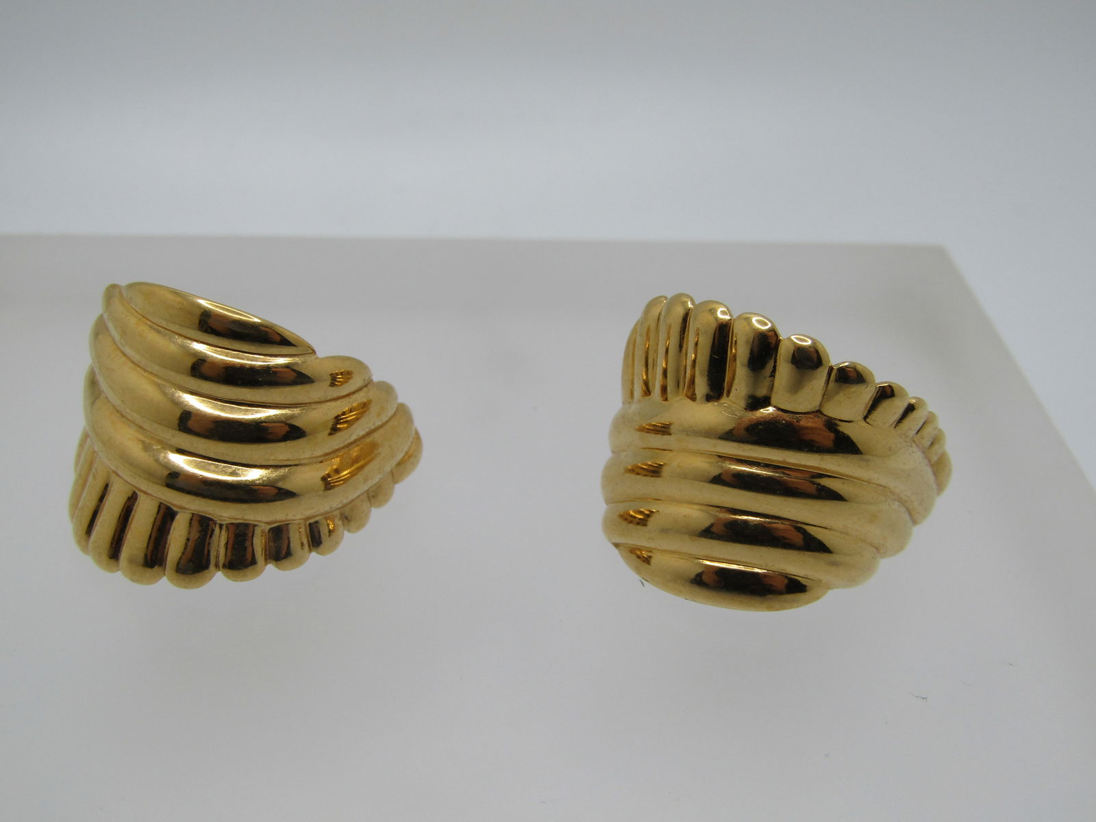 Vintage Monet Ridged Half-Hoop Earrings, Pierced, Gold Tone - 1970's-1980's: Vintage Monet Ridged Half-Hoop Earrings, Pierced, Gold Tone - 1970's-1980's. These have curvesd ridged that are tapered in length going down the leght of the earigns with one edge having them go horit