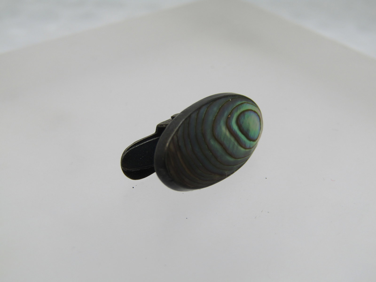 Vintage Sterling Abalone Clip, Oval, 1940's-1950's: Vintage Sterling Abalone Clip, Oval, 1940's-1950's. It is an oval appx. 3/4" long and slightly under 1/2" tall. It is marked sterling top - the clip is silver tone. The finish on the clip does haveoxi