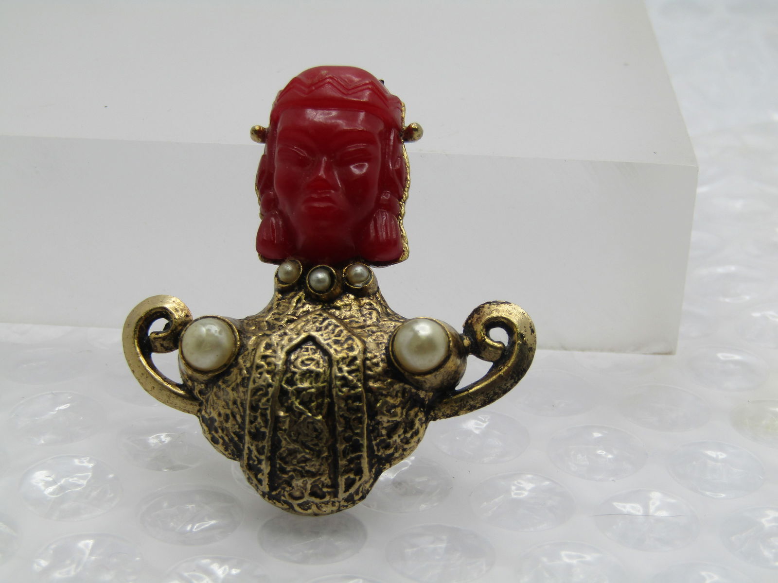 Vintage Asian/Thai Princess Brooch, Unsigned Selro/Selini, Mid-Century: Vintage Asian/Thai Princess Brooch, Unsigned Selro/Selini, Mid-Century. this has a molded heard plastic face with faux pearl collar and accents. textured finish - gold tone with a black wash. It