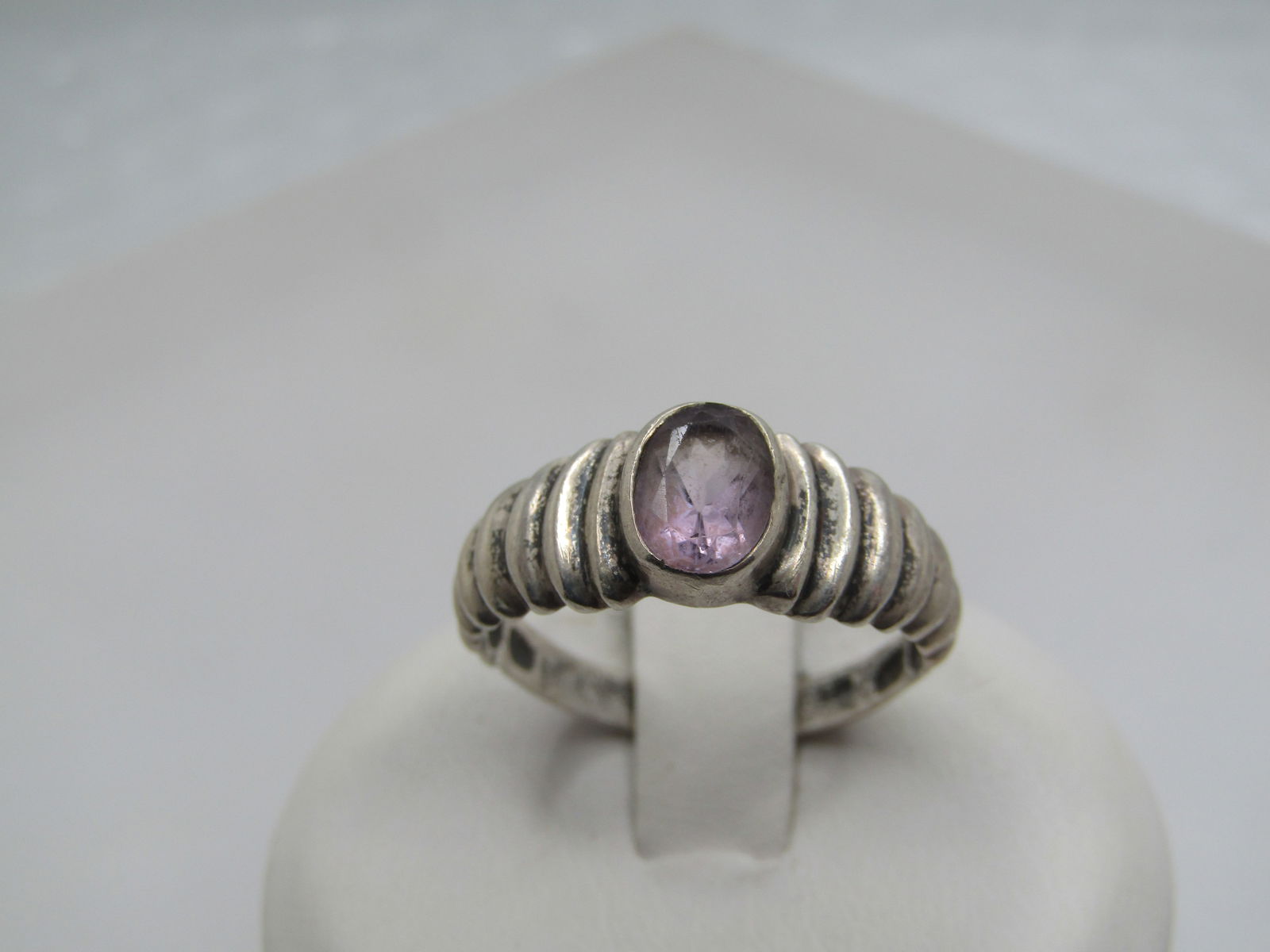 Vintage Sterling Amethyst Ring, Ridged Band, Sz. 7.75, Signed: Vintage Sterling Amethyst Ring, Ridged Band, Sz. 7.75, Signed SU. Marked .925 at 2.33 gr. Tests as sterling. The amethyst is bezel-set and slightly raised over the band. It is appx. 7mm by 5.5mm. The