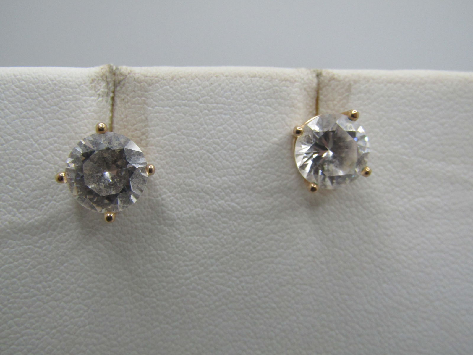 Sterling 1.75 CTW CZ Earrings, Pierced Stud, Gold Over: Sterling 1.75 CTW CZ Earrings, Pierced Stud, Gold Over. The studs will be noticed when worn. They are appx. 7.8mm wide with lots of sparkle. The weight of the earrings (not the cluches) appx. 2.27 gr.