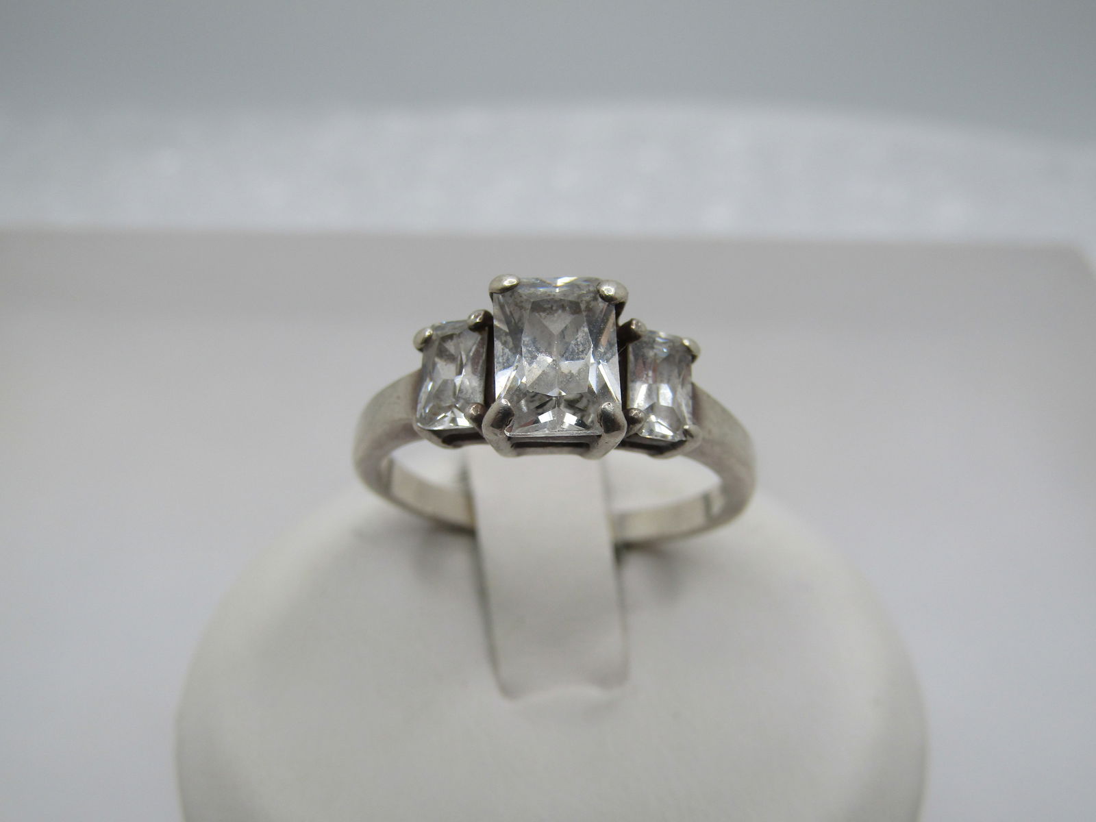 Vintage Sterling Tiered CZ Ring, Sz. 7, Princess Cut. 1980's-1990's: Vintage Sterling Tiered CZ Ring, Sz. 7, Princess Cut. The center stone is appx. 7mm by 5mm and the end stones are appx. 5mm by 3mm. The main stone is appx. 1 ctw and the end stones are appx. .30 ctw e
