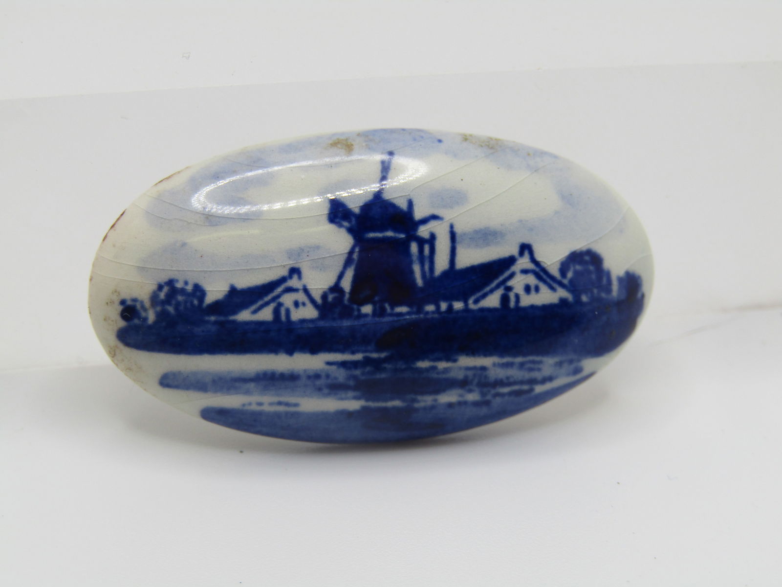 Vintage Delft, Holland Village Brooch, Hand-Painted, 1950's-1960's: Vintage Delft, Holland Village Brooch, Hand-Painted, 1950's-1960's 1.75" wide and 1" tall and domed. It is a windmill with village looking into the village from the water. Hand painted and signed