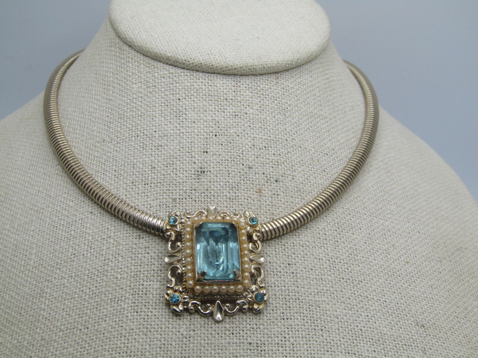 Vintage Faux Aqua & Pearl Necklace, 15.5", Omega Chain, 1970's-1980's: Vintage Faux Aqua & Pearl Necklace, 15.5", Omega Chain, 1970's-1980's. The Slide is a scrolled rectangular bsae shape with an aqua rhinestone in each corner with a tier of faux pearls set in a rectang