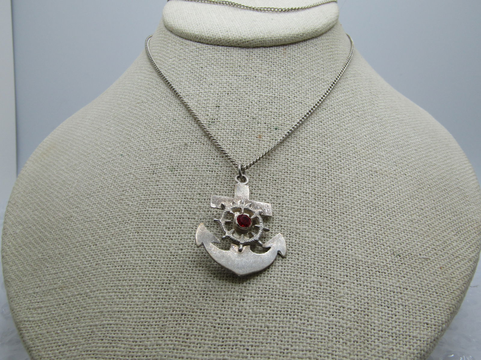 Vintage Cruicifix & Anchor Necklace, Two-Sided, Peru, 22", Unisex, 1960's, 1970's: Vintage Cruicifix & Anchor Necklace, Two-Sided, Peru, 22". The pendant is an anchor with a ships' wheel and red stone in the center. The back has a cruicifix which is part of the back of the