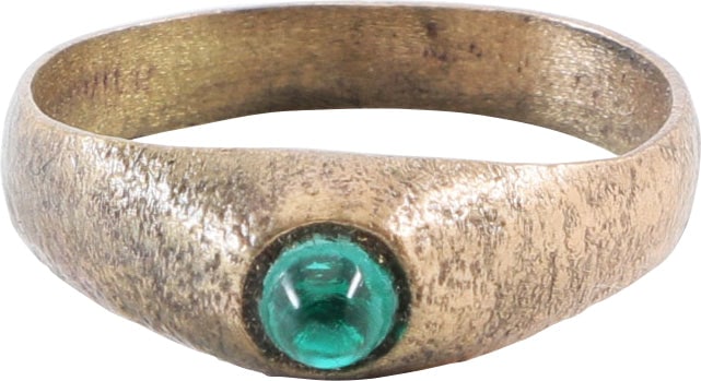 EUROPEAN LADIES FASHION RING, C.1300-1400, SIZE 11 1/2: Gilt bronze, size 11 1/2. Round face band, 4.2mm, flaring to the shoulders. Tall bezel with, mounting a green “stone”, probably replaced. Some wear from use and surface texture from