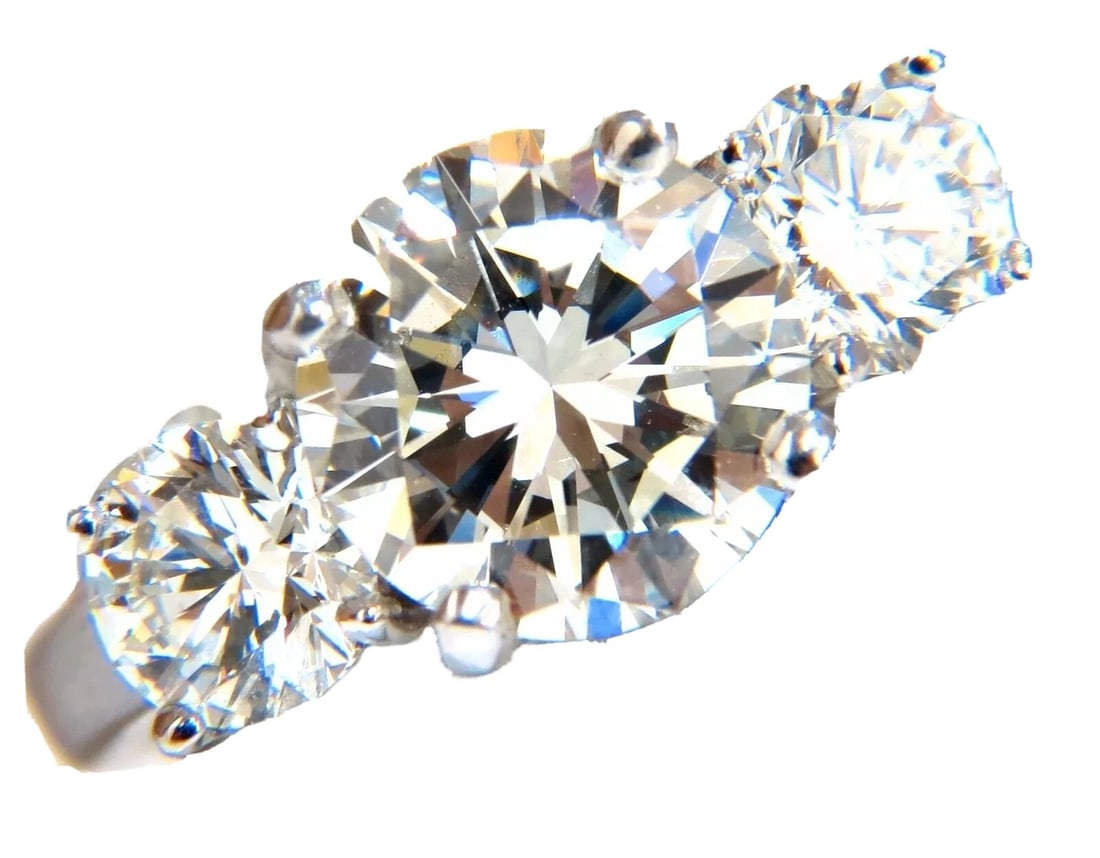 GIA 4.41CT NATURAL ROUND BRILLIANT DIAMOND RING CLASSIC THREE+: Title: GIA 4.41CT NATURAL ROUND BRILLIANT DIAMOND RING CLASSIC THREE+ Description: GIA certified, Classic Three 3.01ct. Center Round Brilliant diamond. GIA Report: 2155730907 J-color Vs-1 clarity