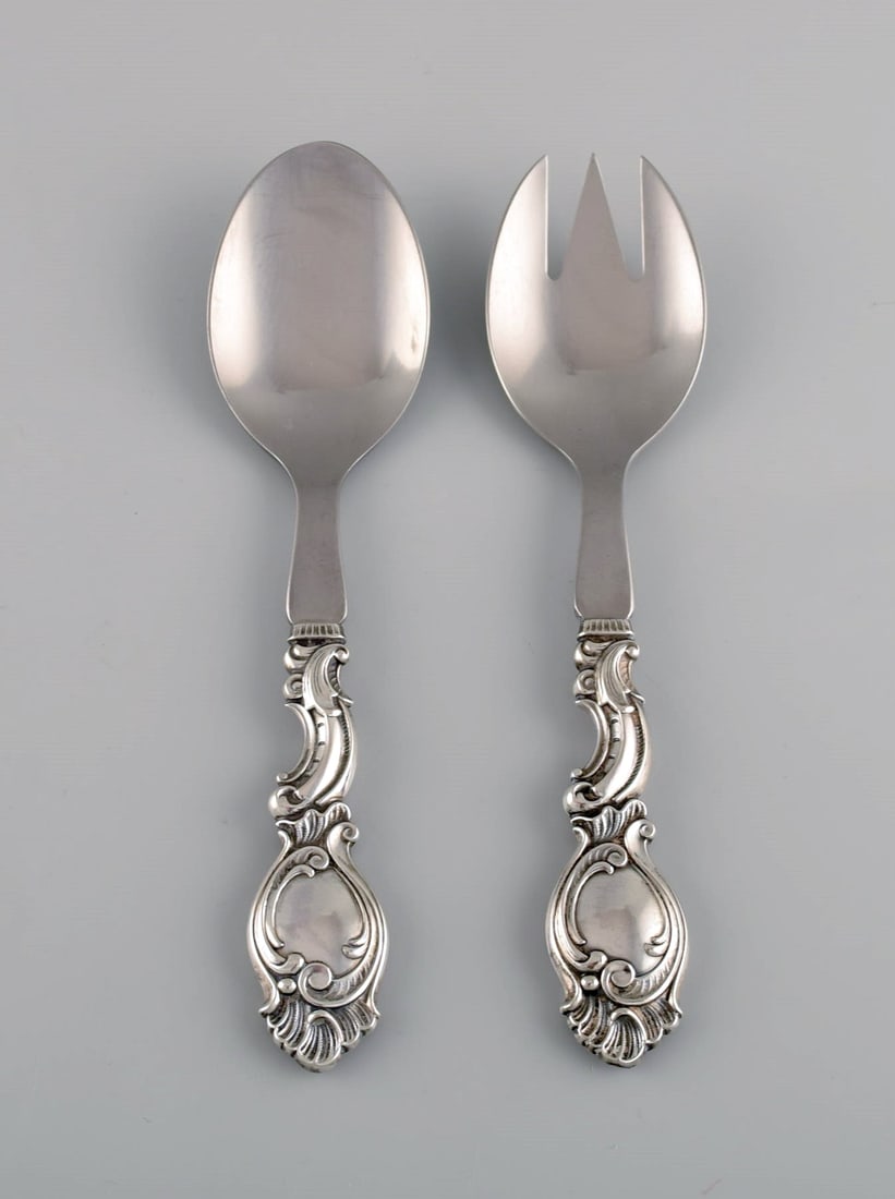 Danish silversmith. Five serving parts in silver (830). Rococo style, 1940s. - 2